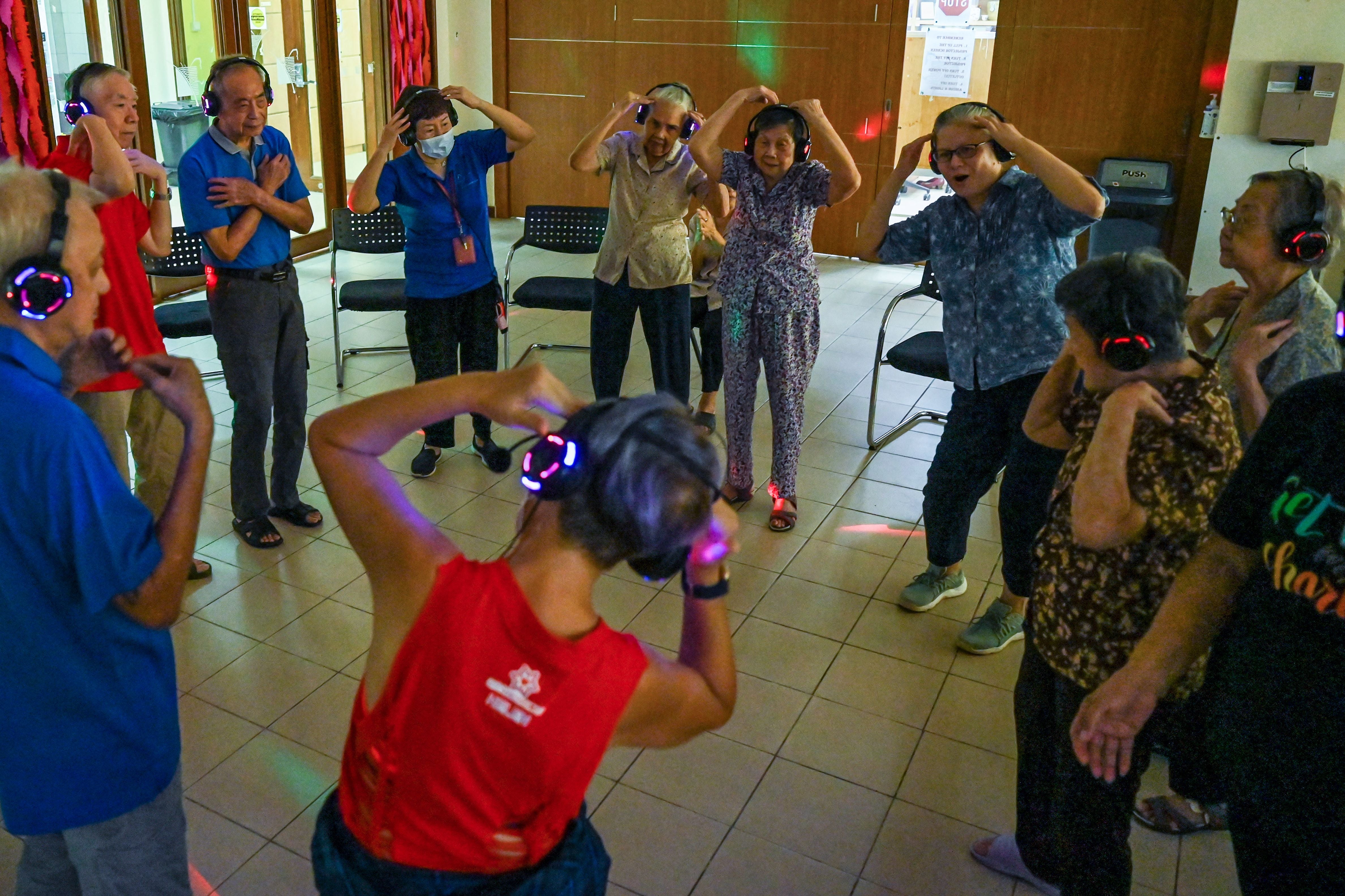 <p>Residents with dementia participating in a silent disco </p>