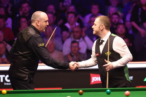 <p>Mark Allen shakes hands with Mark Williams after their first-round match at Alexandra Palace</p>