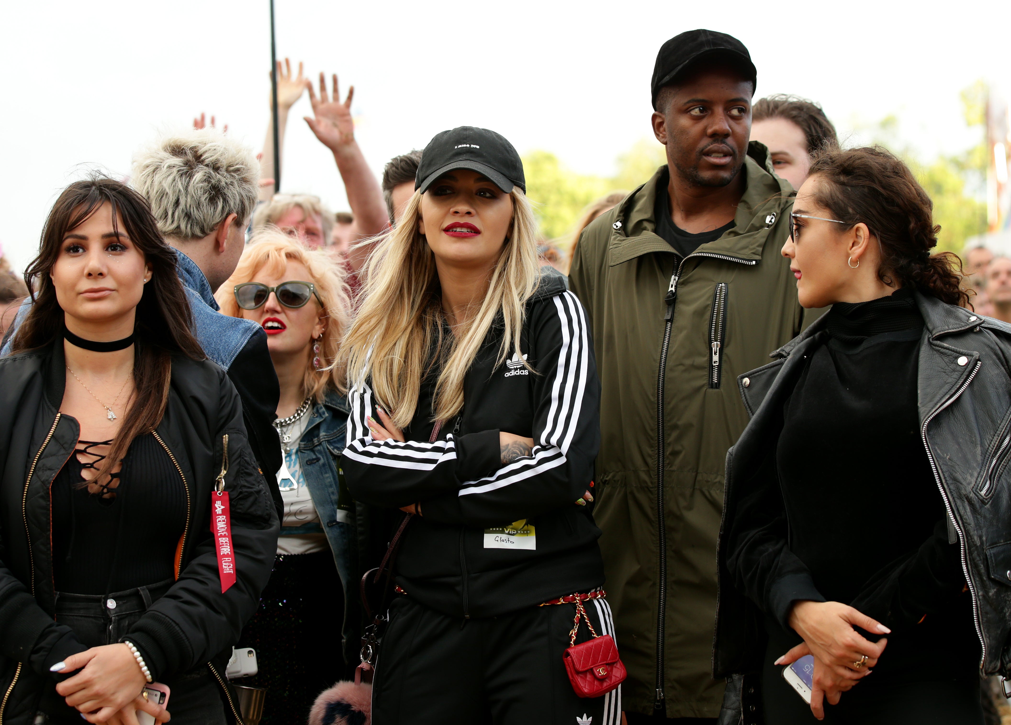 Rita Ora in a baseball cap, red lip and tracksuit at Glastonbury festival 2016 (Yui Mok/PA)