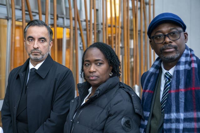 Lawyer Aamer Anwar, left, with Shehu Bayoh’s sister Kadi Johnson and her husband Ade Johnson (Jane Barlow/PA)