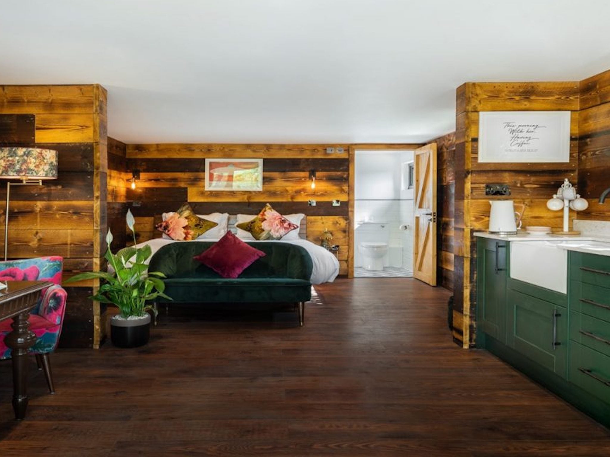 The Hideaway is a treehouse-style cabin with its own decking area, kitchen and living area