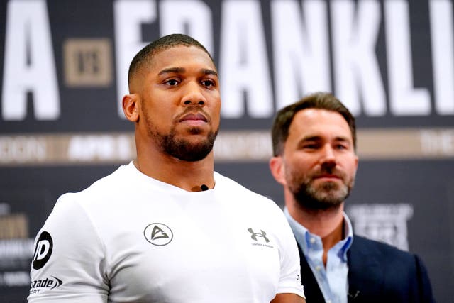 <p>Anthony Joshua (left) standing beside promoter Eddie Hearn</p>