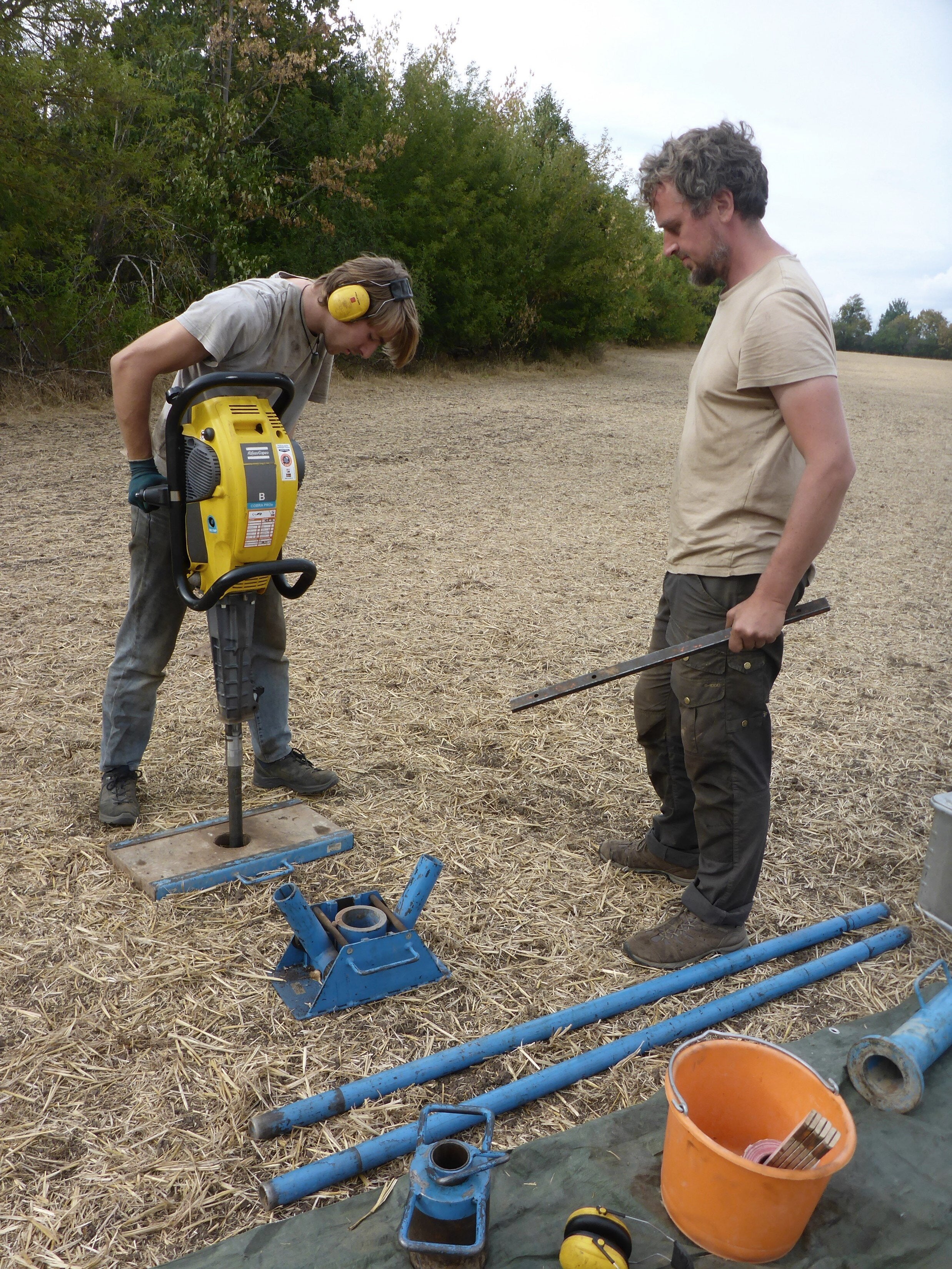 <p>Study co-authors Nik Usmar (left) and Dr Michael Hein (right) carry out sediment coring to locate a medieval plague mass grave near Erfurt</p>