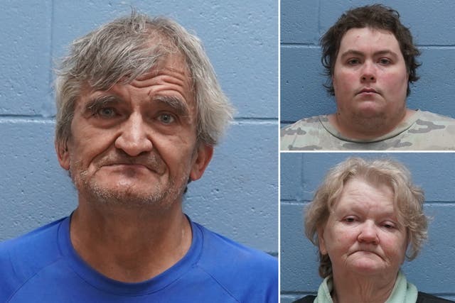 <p>Three people were arrested after nearly 30 dead dogs were found at their address in Beauregard community</p>