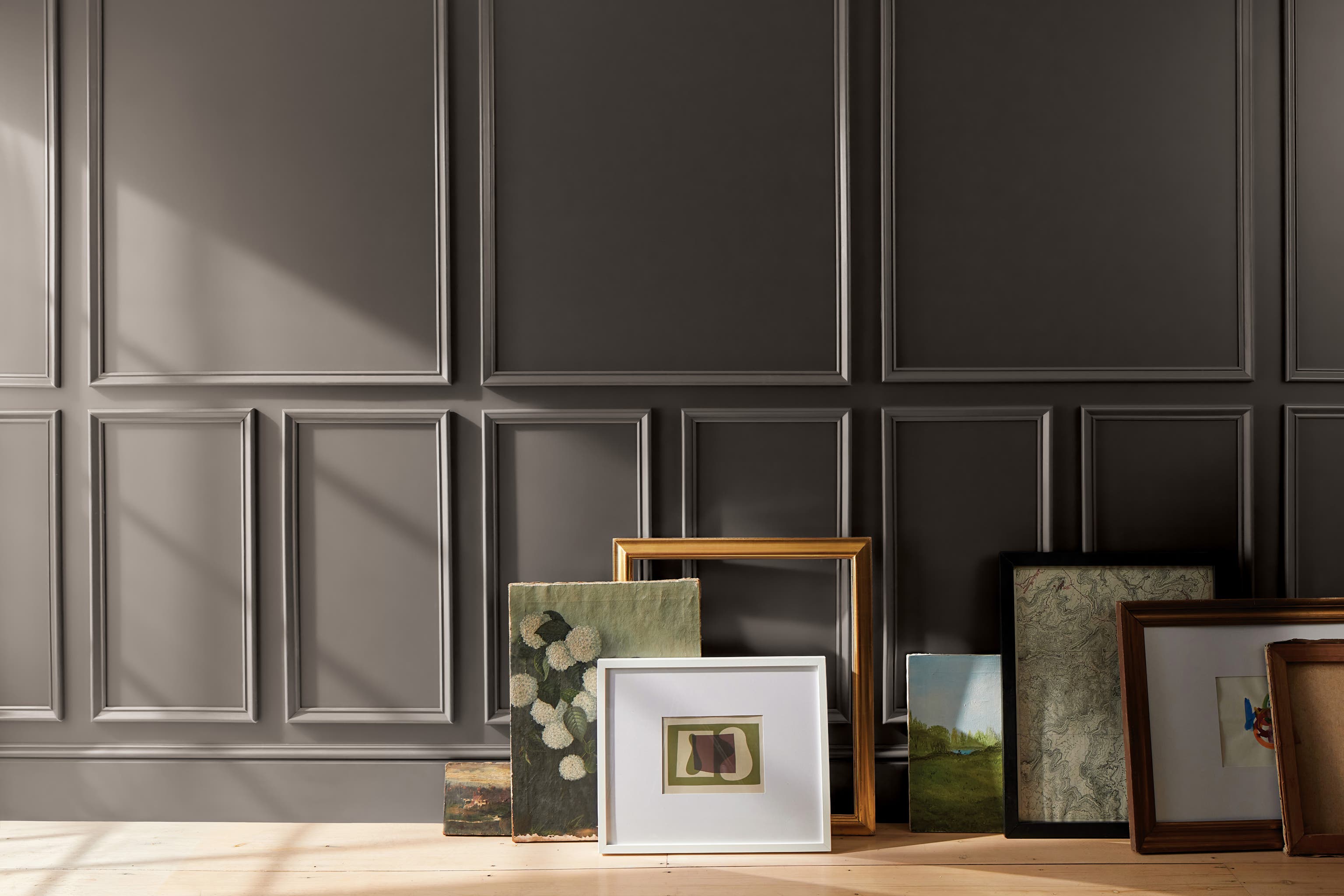 Decorating with a dark palette creates warmth with similar accents (Benjamin Moore/PA)