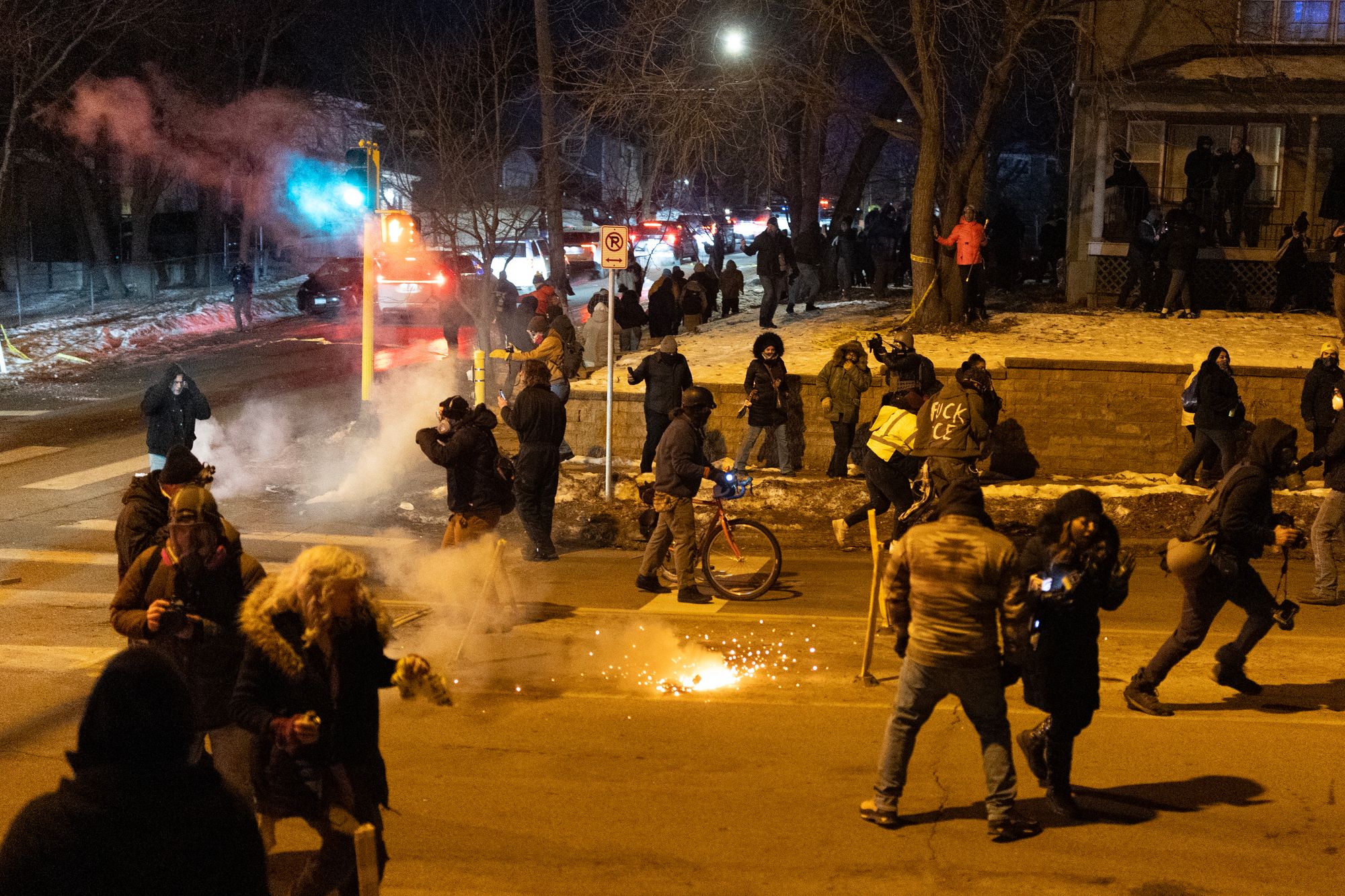 Federal agents launch tear gas at residents protesting a shooting incident on January 14, 2026 in Minneapolis, Minnesota