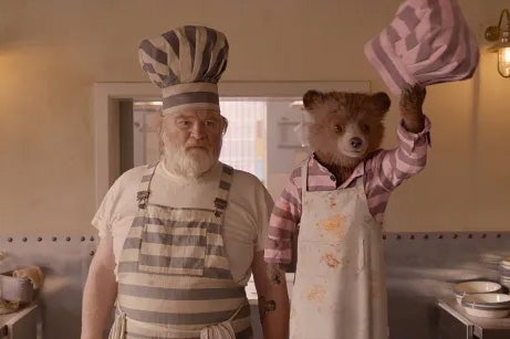 Like bread and marmalade: Knuckles McGinty and the titular bear in ‘Paddington 2’