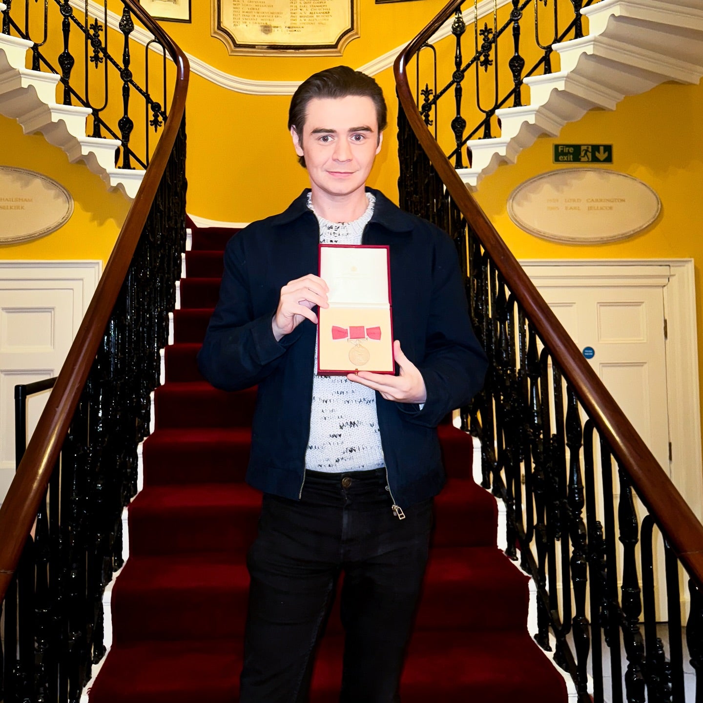 Ryan Riley with his British Empire Medal at Downing Street