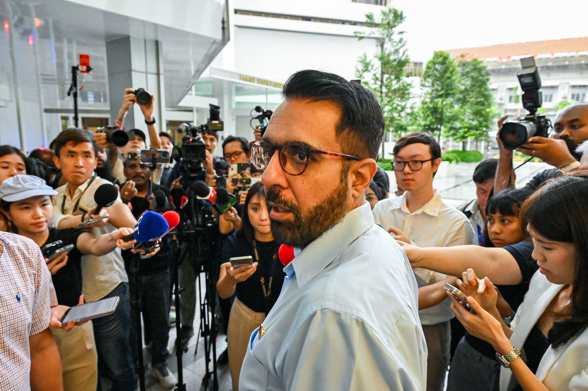 Pritam Singh, secretary-general of the opposition Workers’ Party, speaks to reporters after the verdict in his trial for allegedly lying to the Committee of Privileges (COP), at the State court in Singapore on 17 February 2025. - Singapore’s opposition leader was convicted of covering up a lie told in parliament by a fellow party member in a case that could disqualify him from running in the upcoming national elections