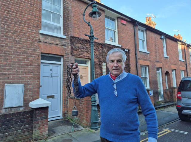 <p>Richard Parkinson says he will chain himself to the historic lamppost in his street in Canterbury if Kent County Council tries to tear it down</p>