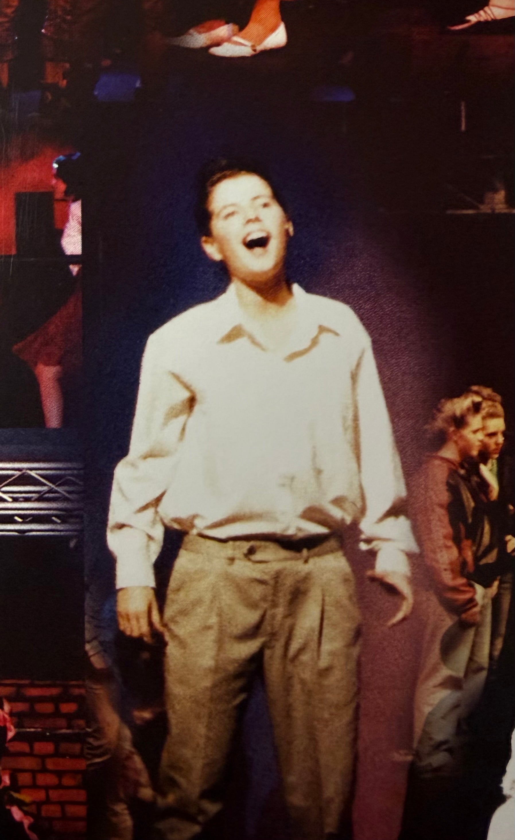 Performing in a school musical production as a teenager