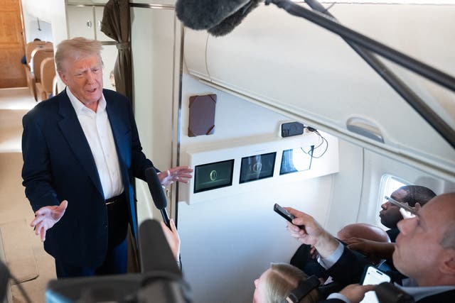 <p>The author (at right) in a gaggle with President Donald Trump aboard Air Force One on May 4, 2025 returning to the White House after spending the weekend in Florida</p>
