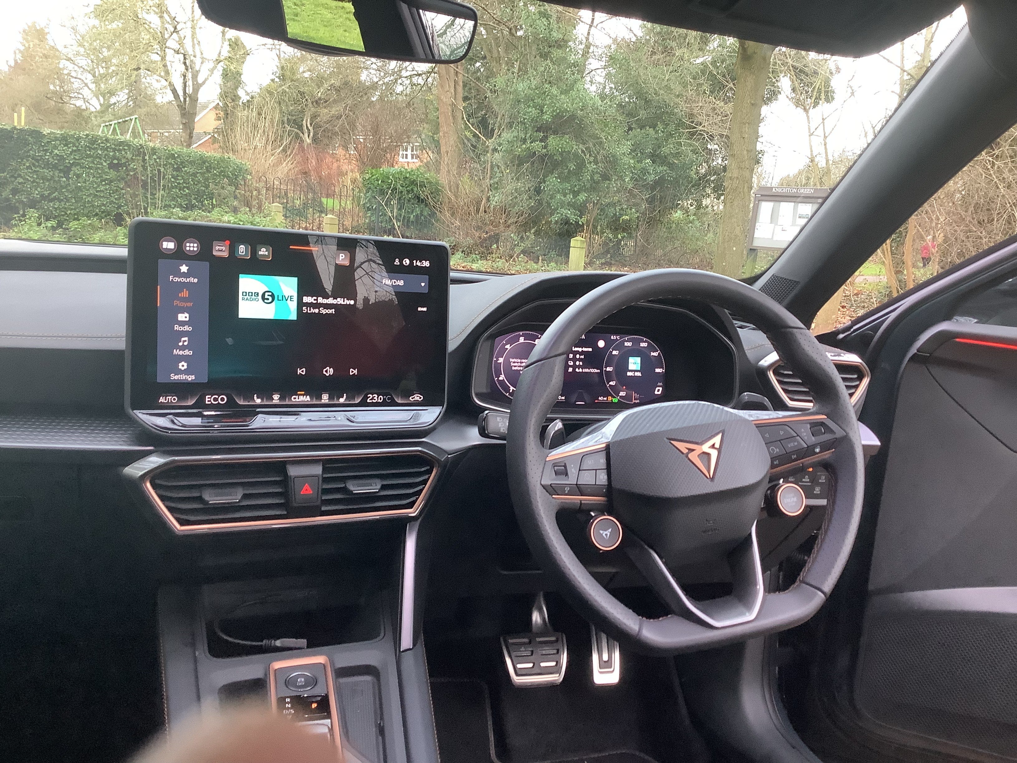 The steering wheel, fortunately, has fingertip control for most functions