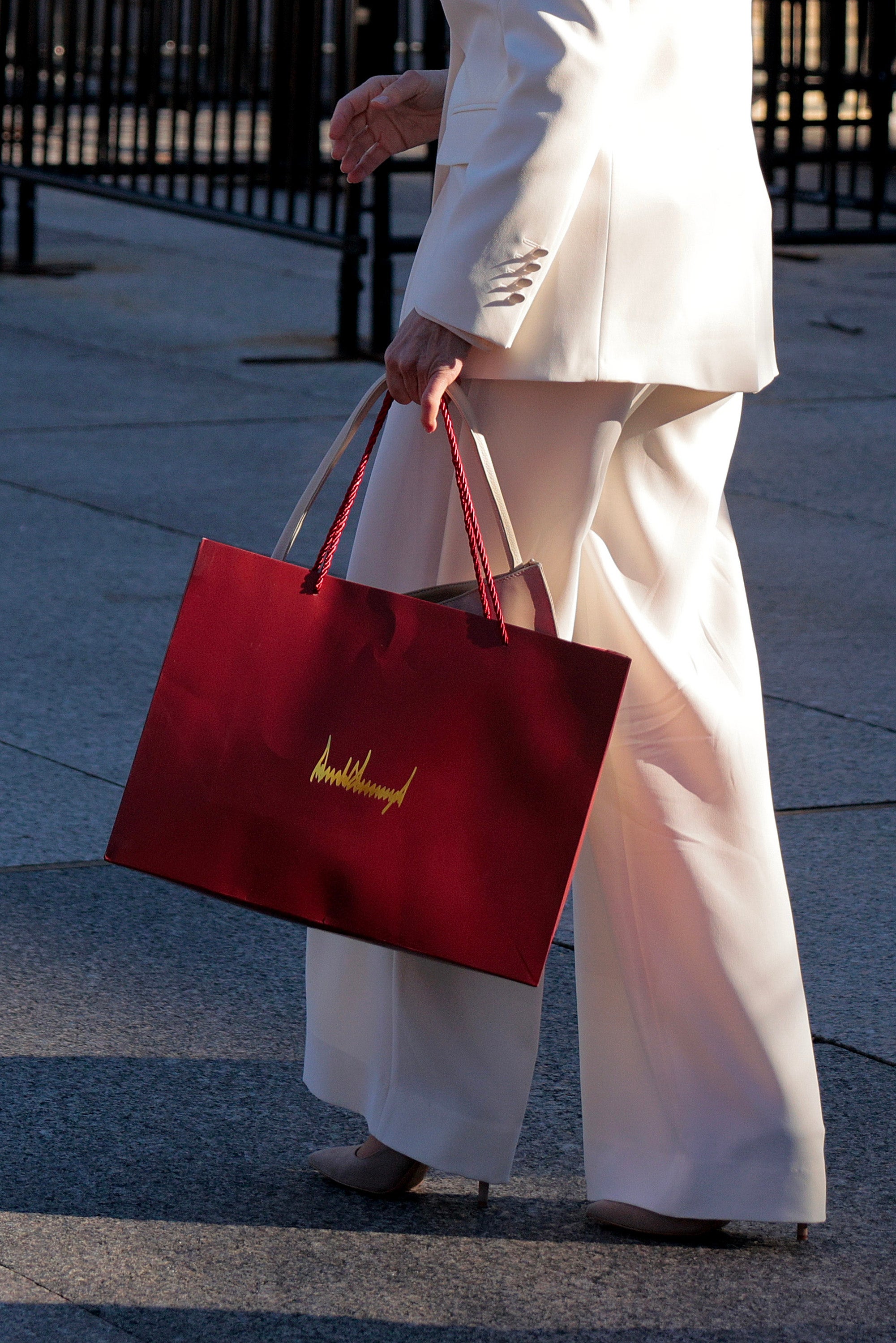 Machado was pictured leaving the White House with a red bag inscribed with the president's signature