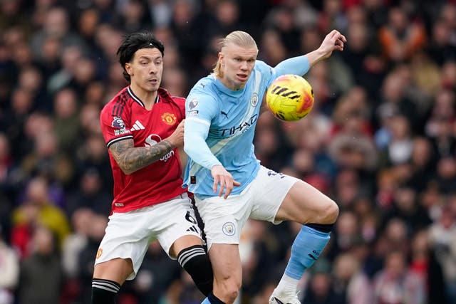 <p>Lisandro Martinez challenges Erling Haaland during the Manchester derby</p>