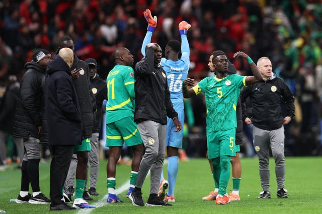 <p>Senegal’s players walked off the pitch in protest at Morocco being awarded a stoppage-time penalty</p>