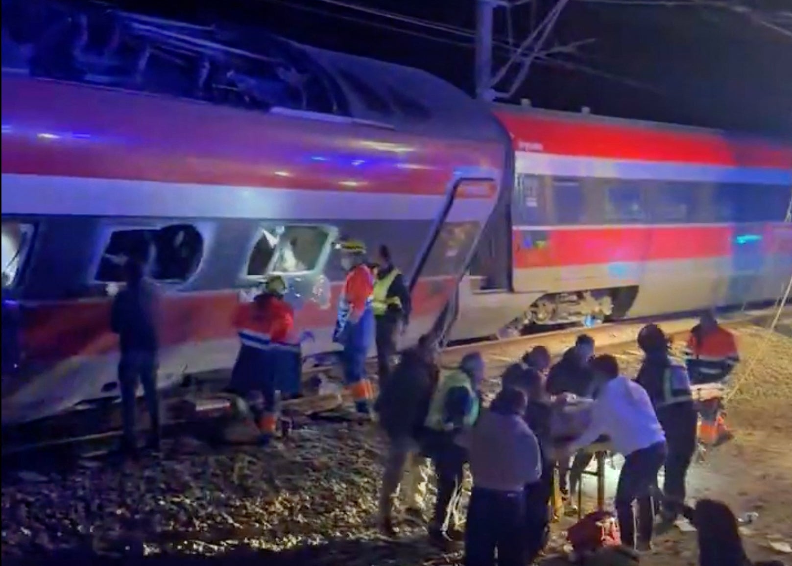 This video grab taken from UGC images posted on social media and verified by AFPTV teams in Madrid, shows emergency personnel working after a train accident in Adamuz, southern Spain