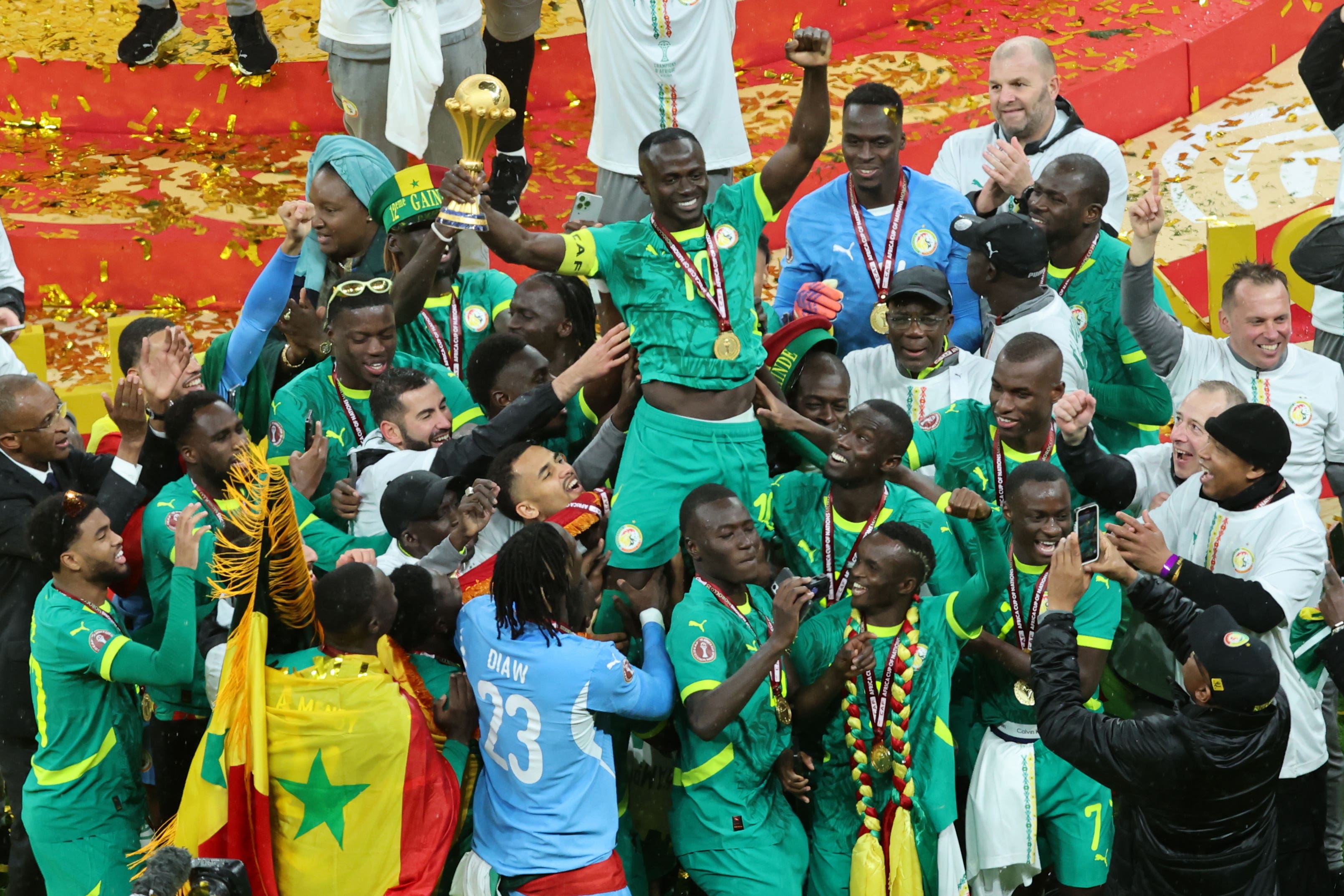 Senegalese players celebrate after winning the Africa Cup of Nations (Youssef Loulidi/AP)