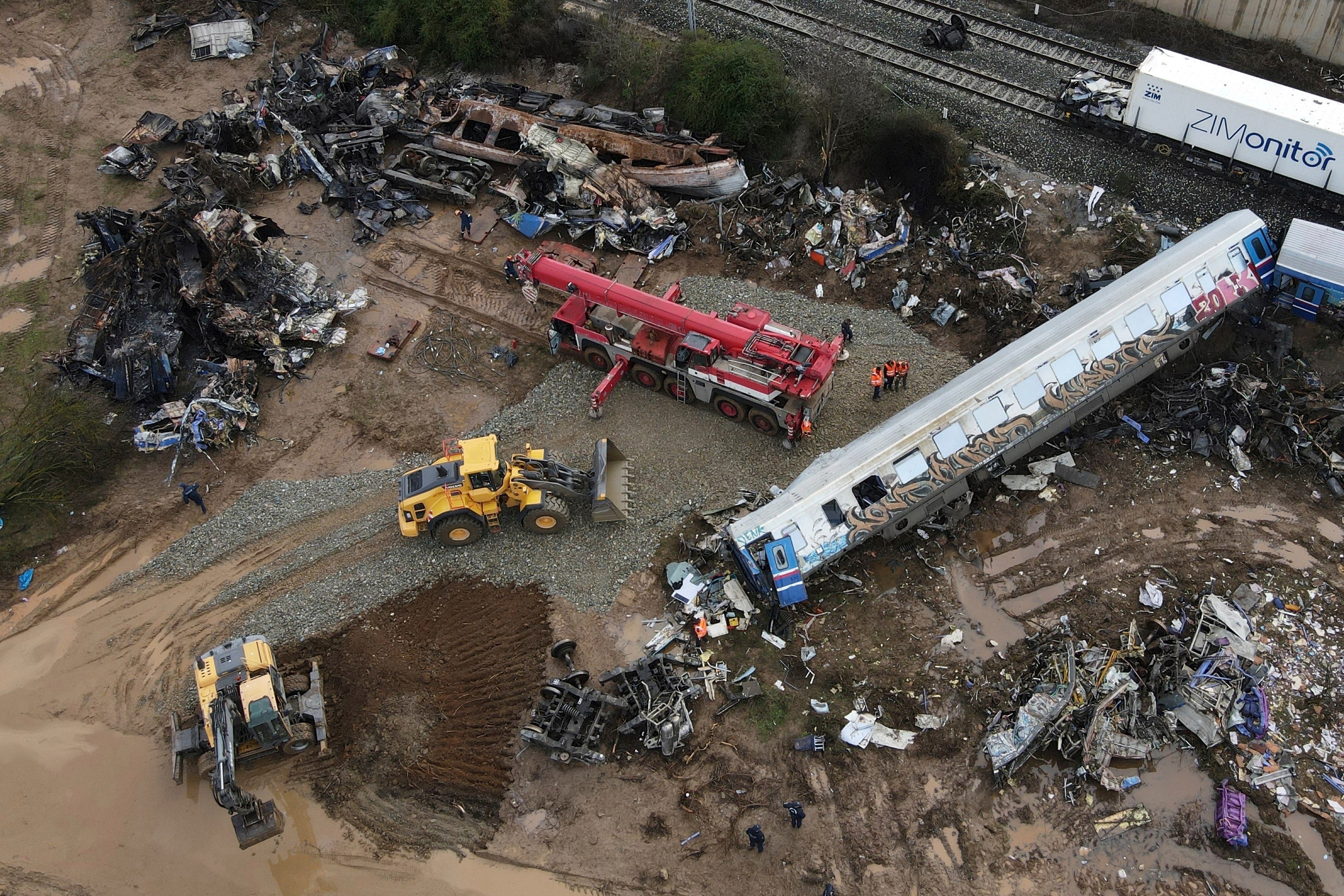 Rescuers at the site of a train collision in Tempe, about 376 kilometres (235 miles) north of Athens, near Larissa city, Greece on 3 March, 2023
