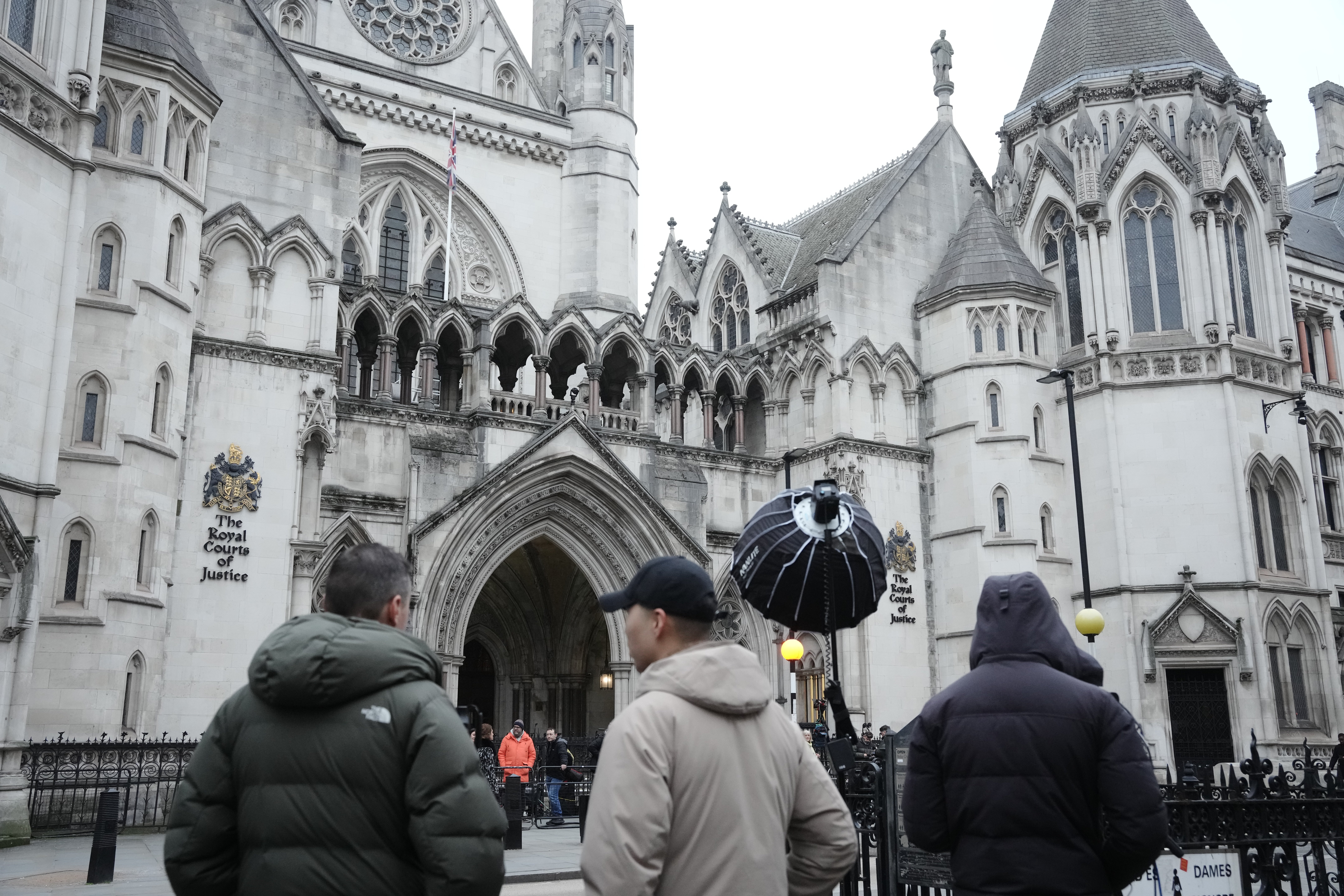 Media gathered outside the Royal Courts of Justice (Jeff Moore/PA)