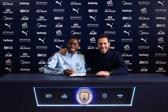 <p>Marc Guehi with Hugo Viana after signing for Manchester City</p>