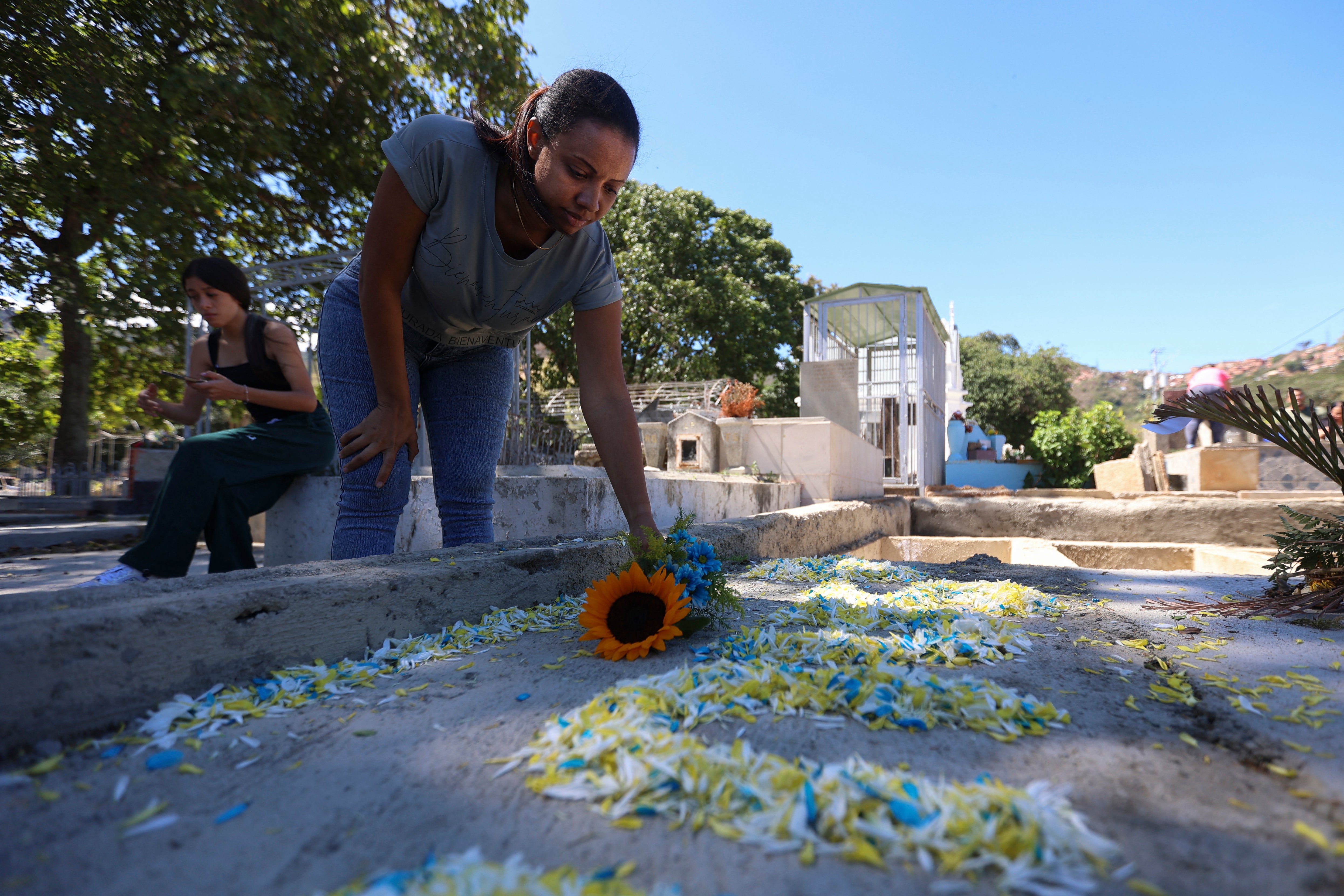 <p>Natividad Martinez, mother of Venezuelan private Saul Pereira Martinez, one of the soldiers killed during the U.S. military operation to topple Nicolas Maduro visits his grave at the General Cemetery of the South in Caracas on January 18, 2026</p>