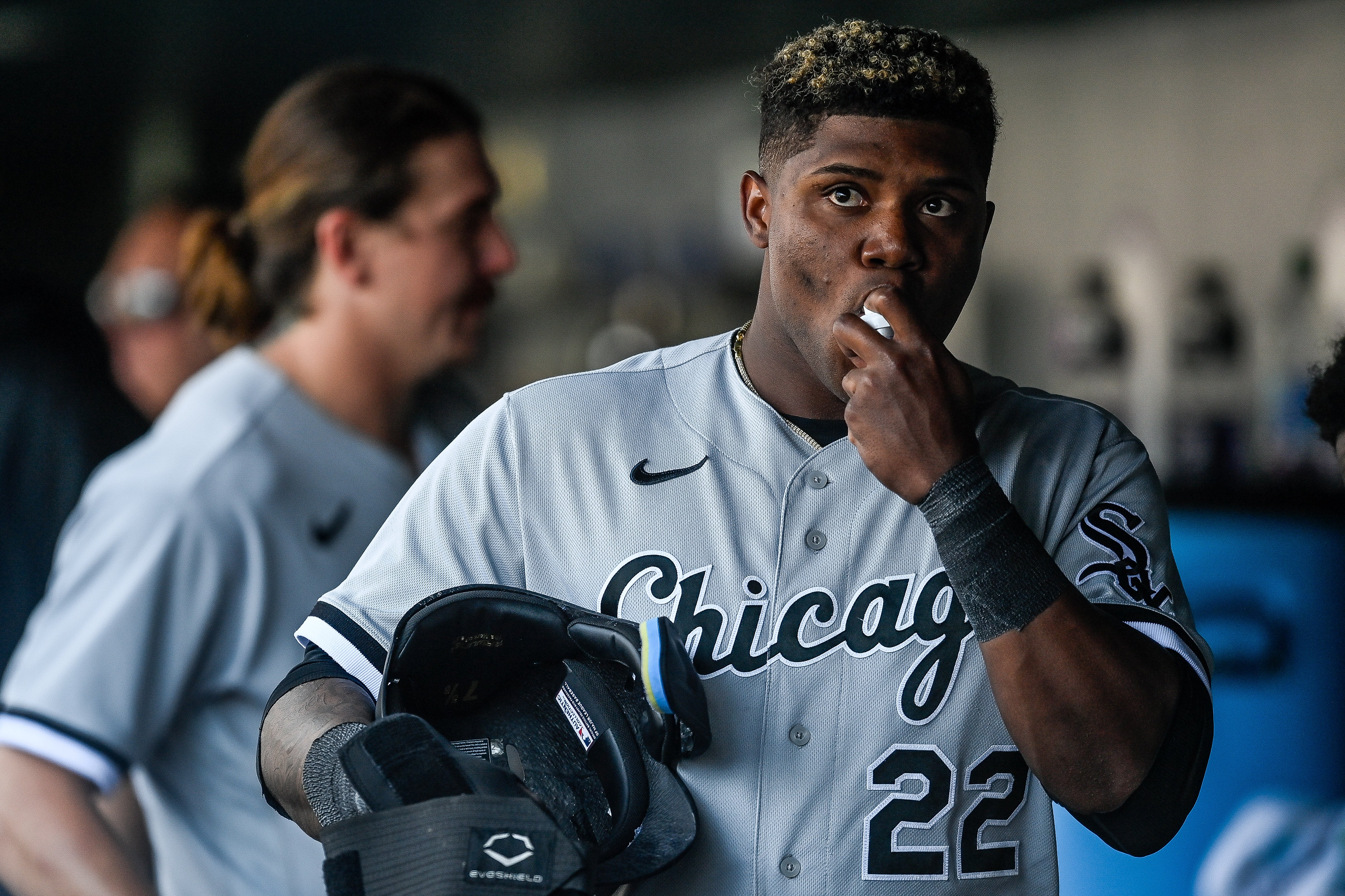 The Chicago White Sox baseball player Oscar Colas uses an inhaler while playing at Coors Field in Denver, Colorado, in August 2023. Exercise can trigger asthma attacks