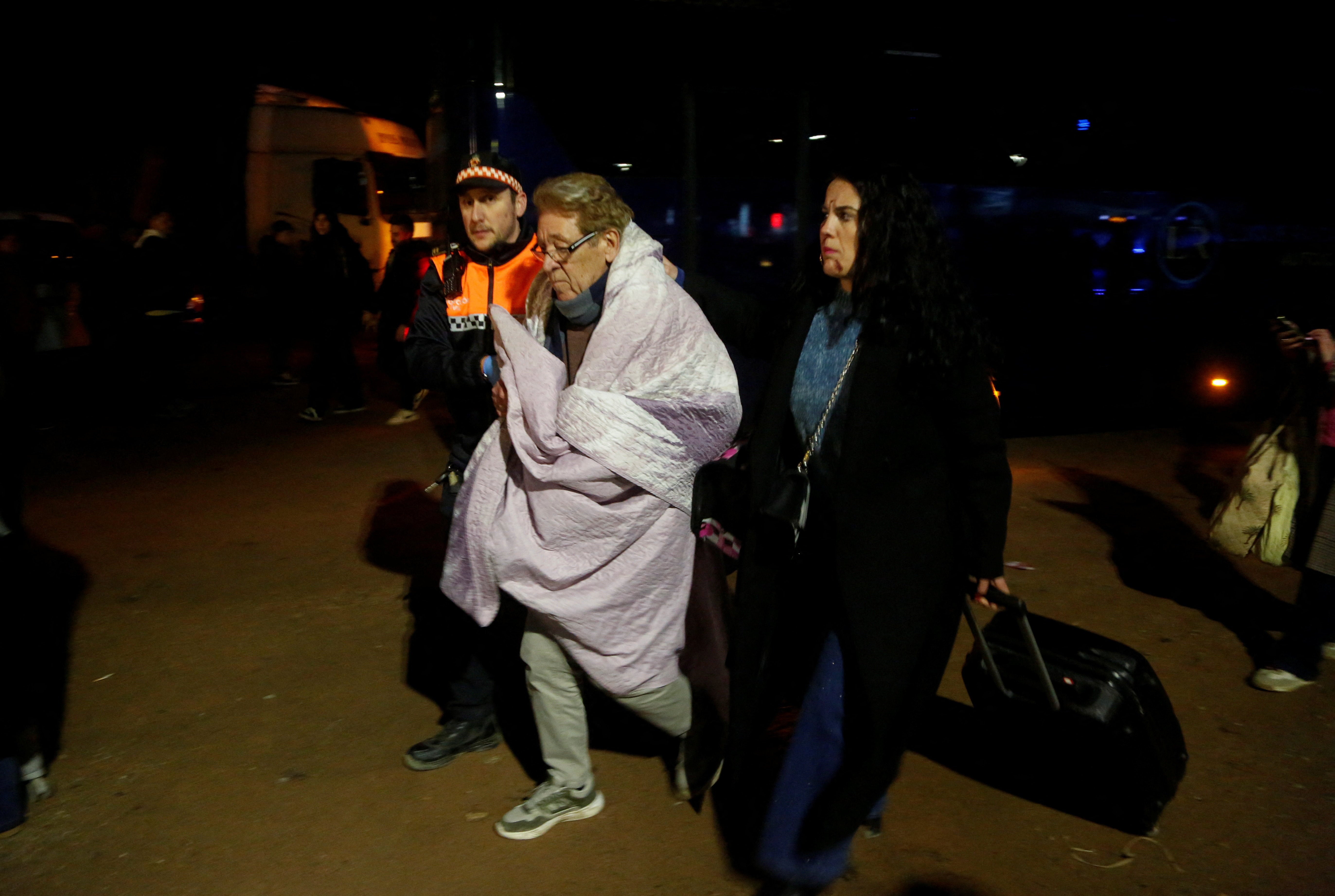 A survivor being taken away to receive treatment