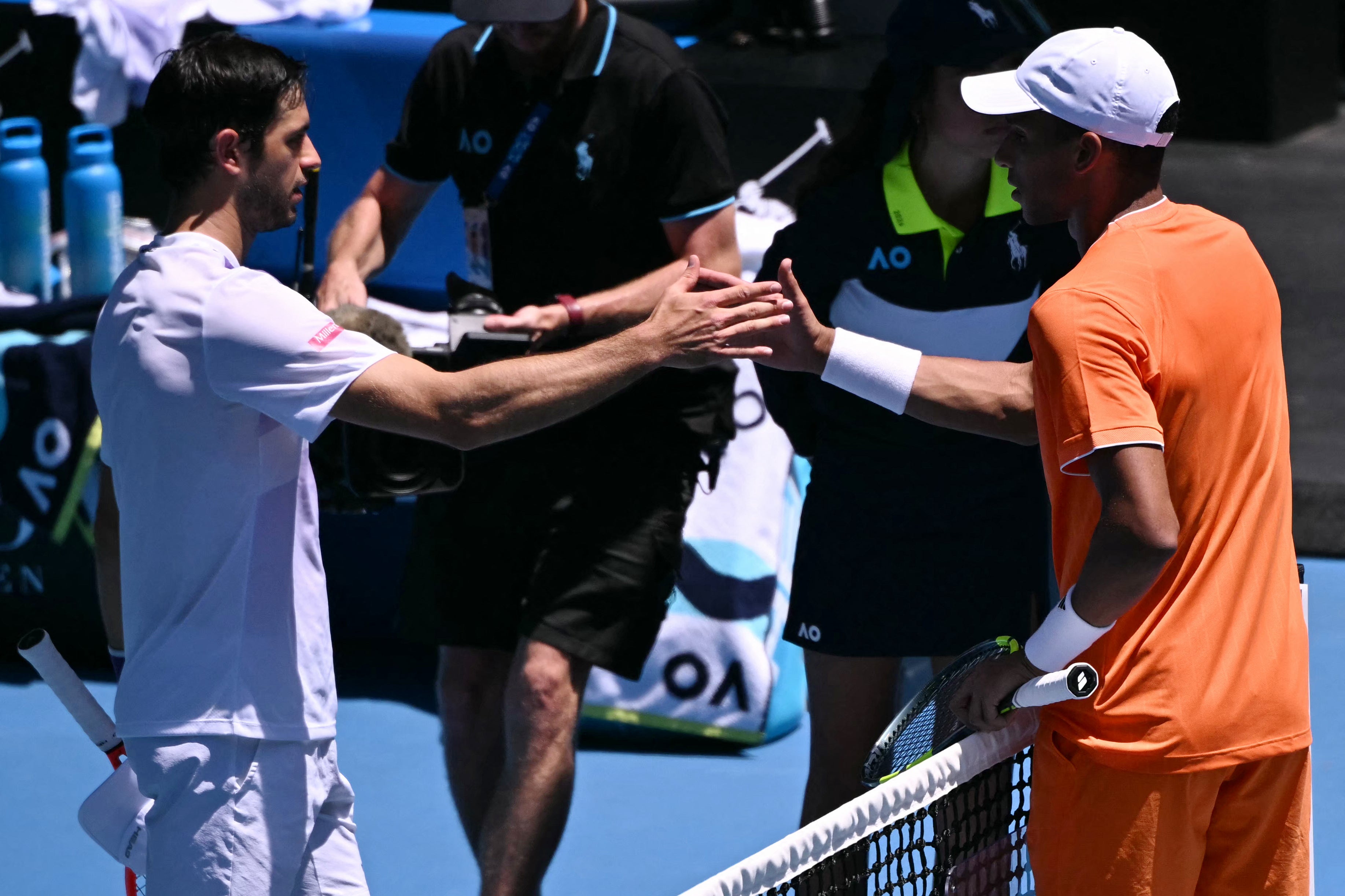 Portugal's Nuno Borges (L) is congratulated by Canada's Felix Auger-Aliassime, who retired from an injury
