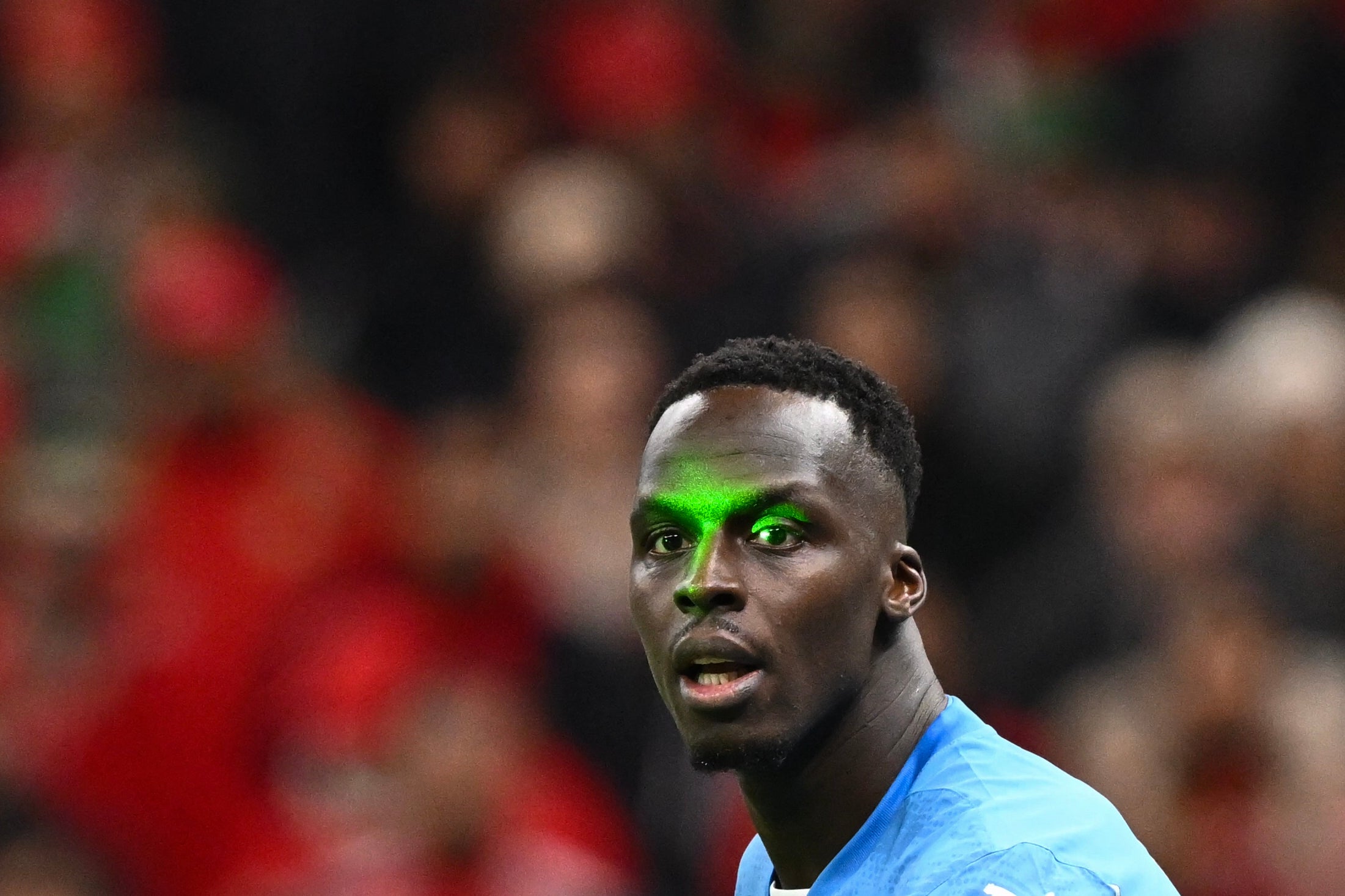 Senegal's goalkeeper Edouard Mendy is targeted by a laser