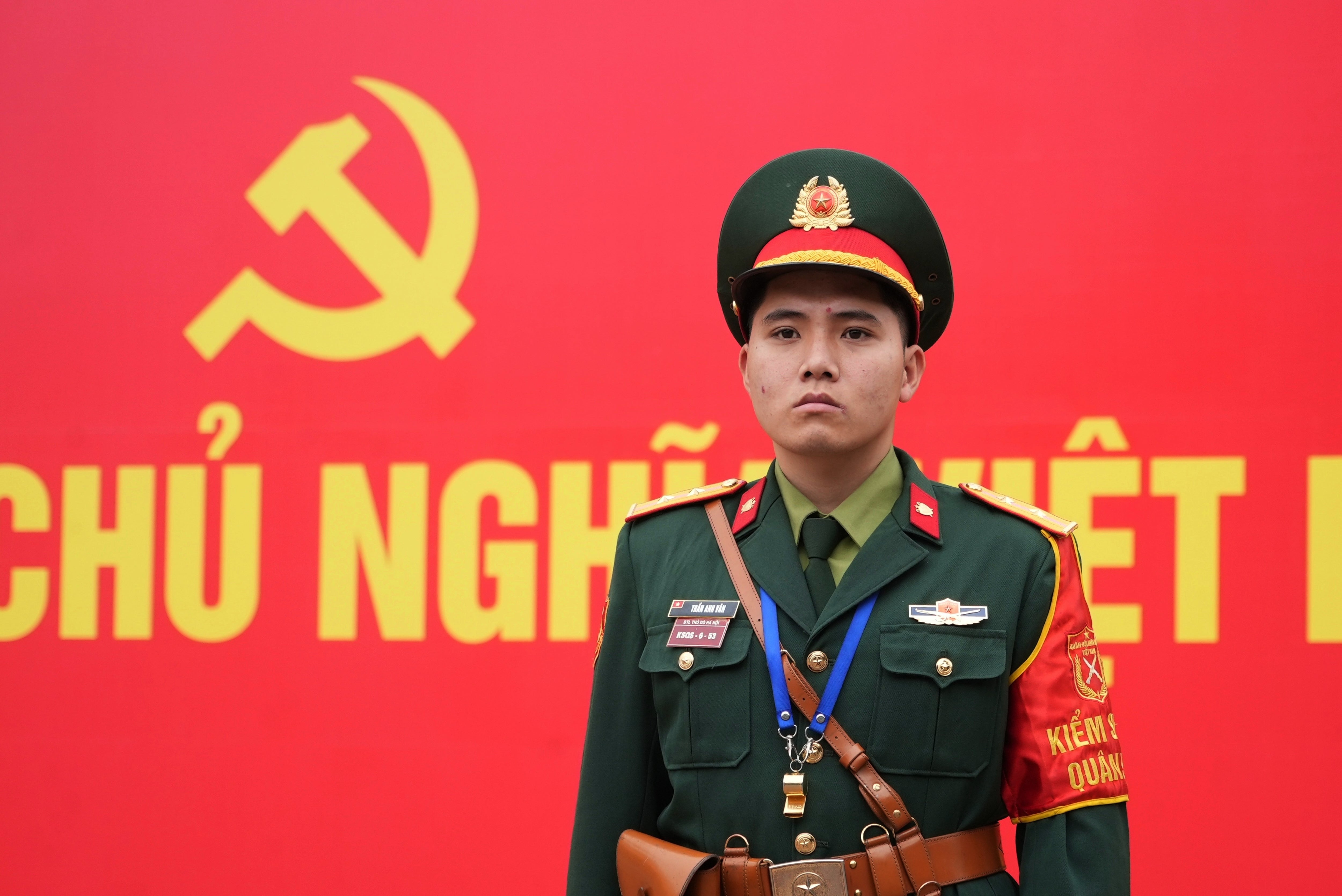 A security officer guards the entrance ofthe National Convention Center during the week-long Congress of the Communist Party of Vietnam in Hanoi.