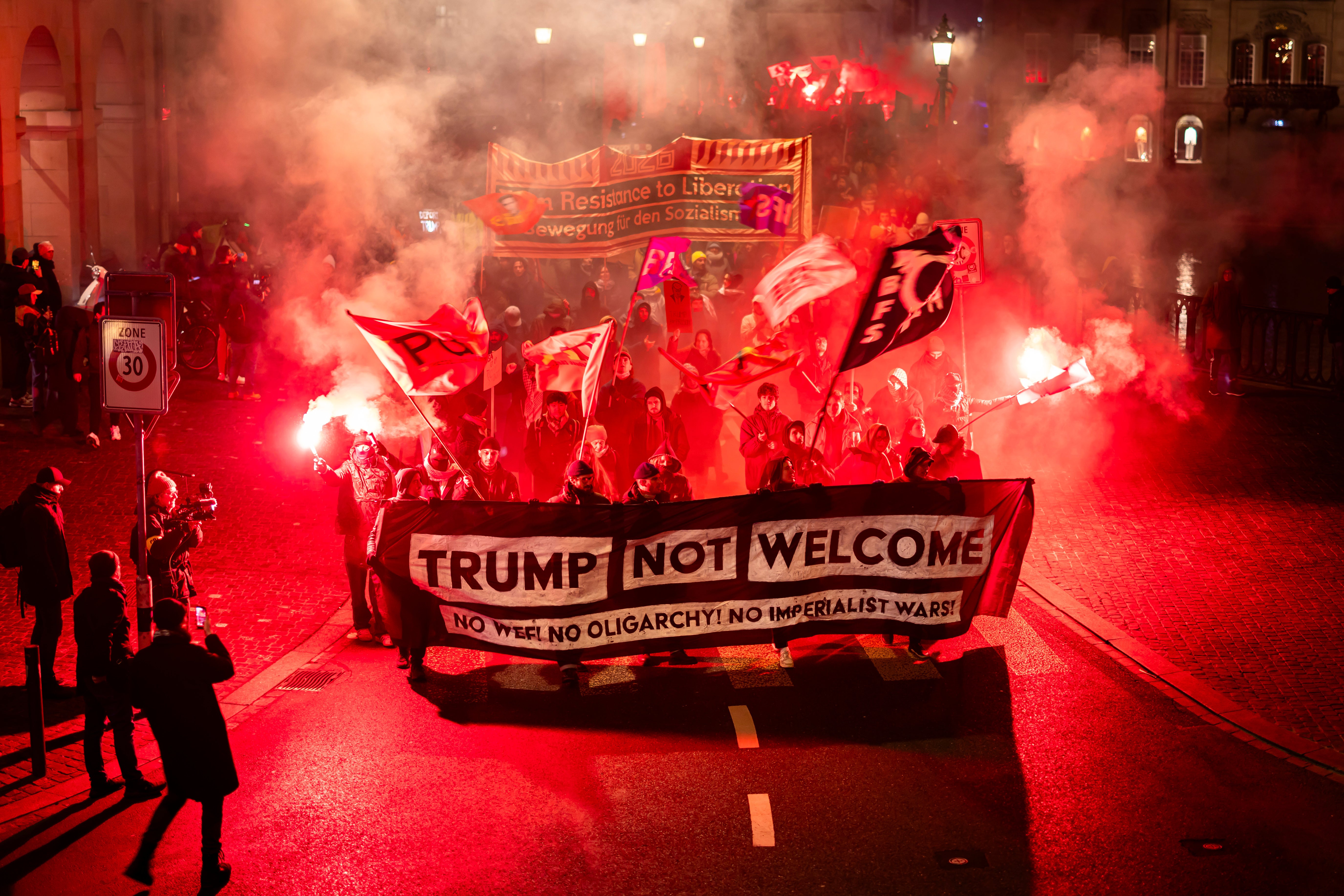 <p>Protesters hold a banner reading "Trump not welcome" during a rally against the World Economic Forum in Davos and the visit of US President Donald Trump, in Zurich, Switzerland, on Monday, Jan. 19, 2026. (Michael Buholzer/Keystone via AP)</p>