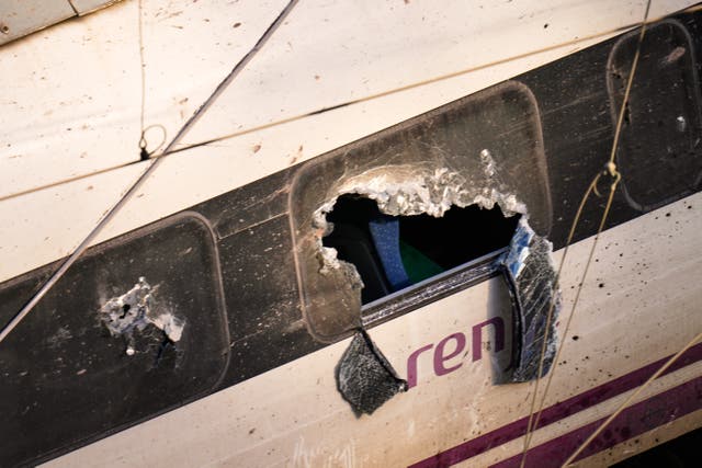 <p>Broken windows of a crashed train are photographed at the site of a train collision in Adamuz, southern Spain, Monday, Jan. 19, 2026. (AP Photo/Manu Fernandez)</p>