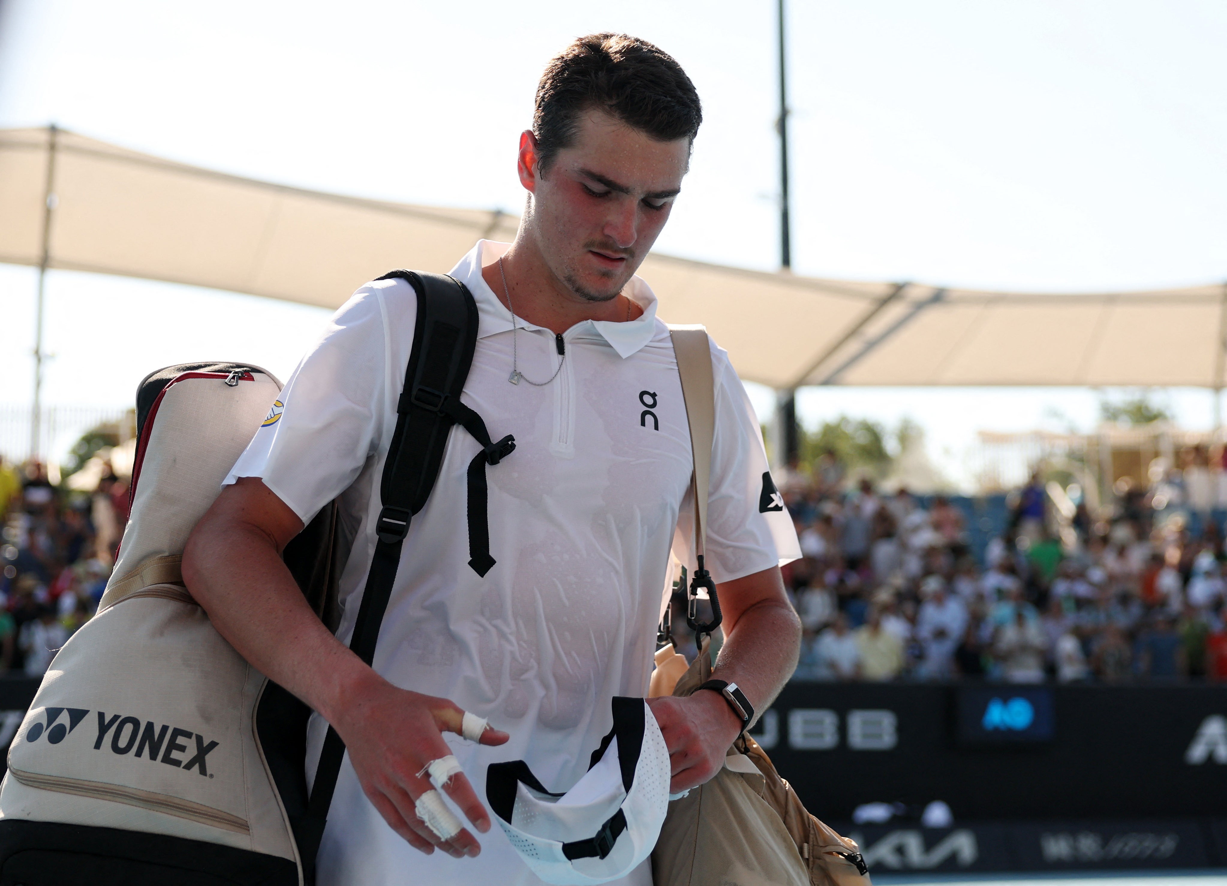 Brazil's Joao Fonseca was knocked out in the opening round after struggling physically against Eliot Spizziri