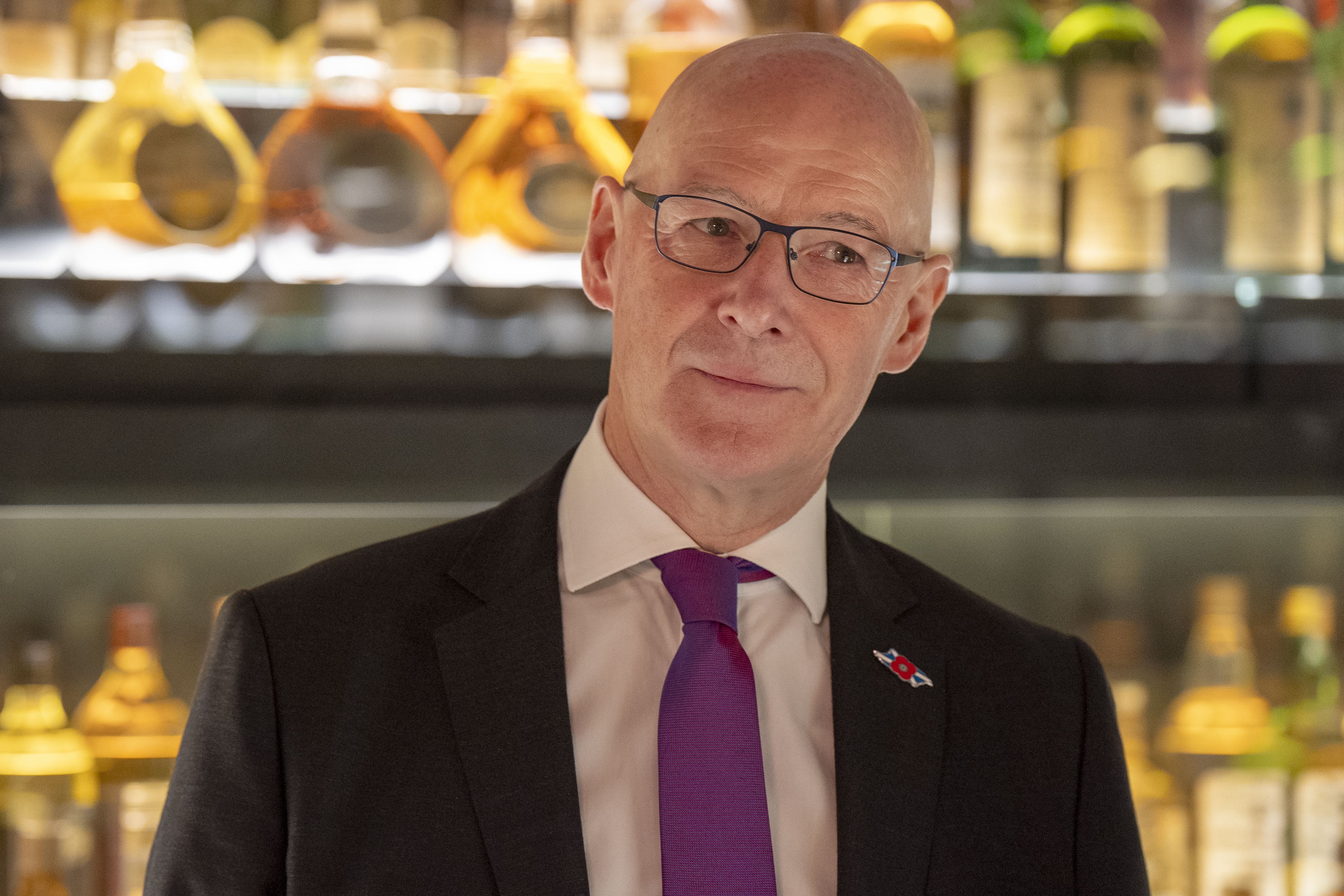 First Minister John Swinney is being urged to ‘reach out’ to Donald Trump amid concerns over the impact a threatened hike in tariffs would have on the Scotch whisky industry (Jane Barlow/PA)