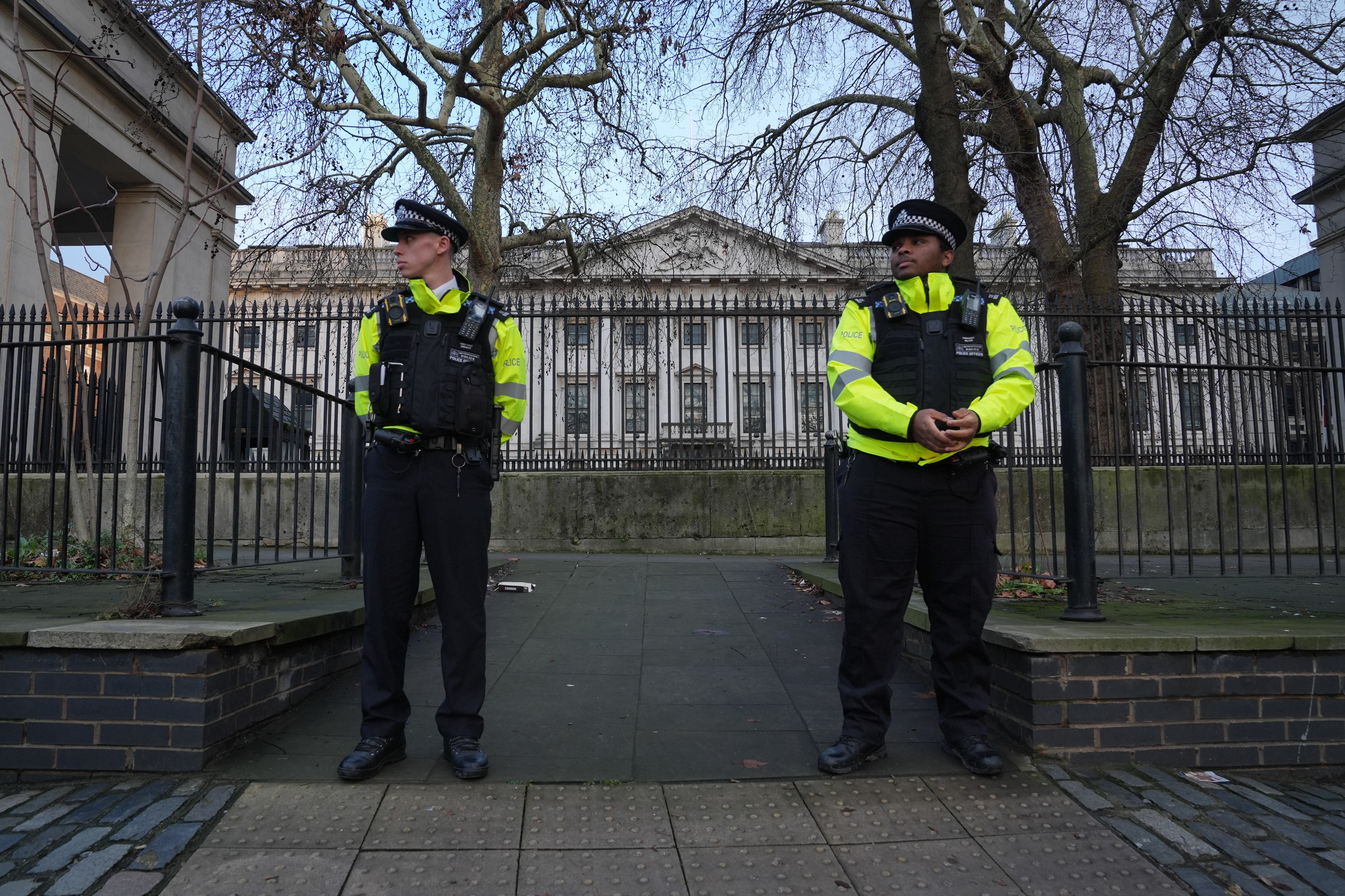 Police officers outside Royal Mint Court, London, where China wants to build its new embassy (Lucy North/PA)