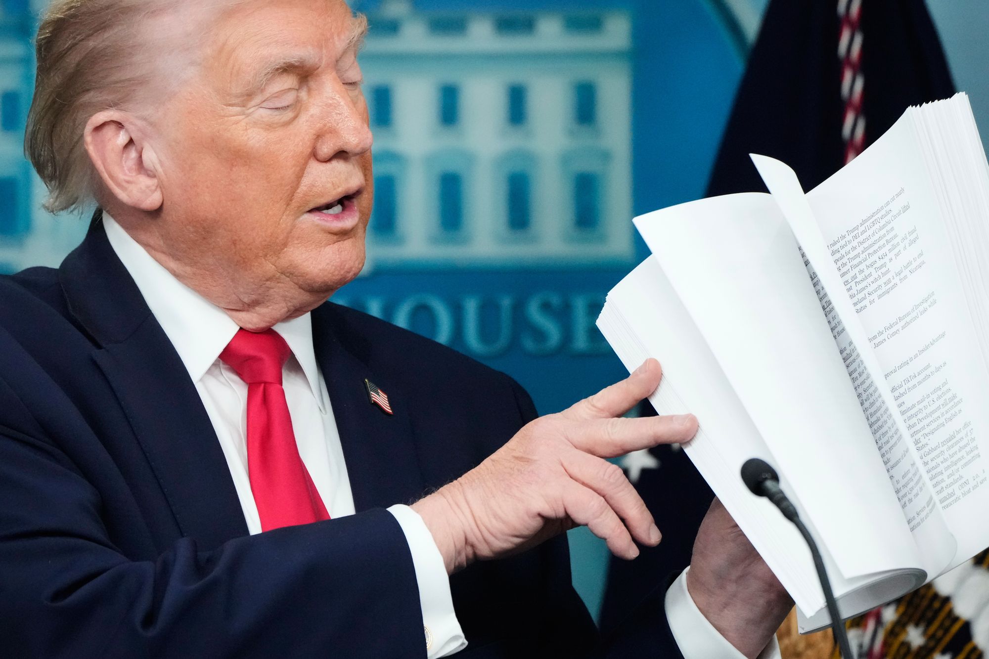 Trump largely sleepwalked through a recitation from a thick stack of papers recapping his first year in office.