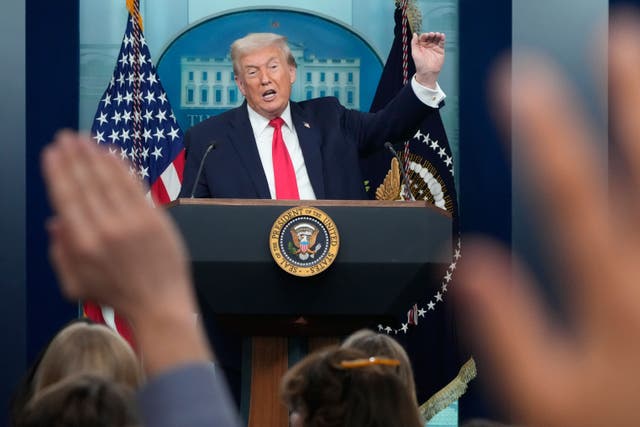 President Donald Trump speaks during a press briefing at the White House (Mark Schiefelbein/AP)