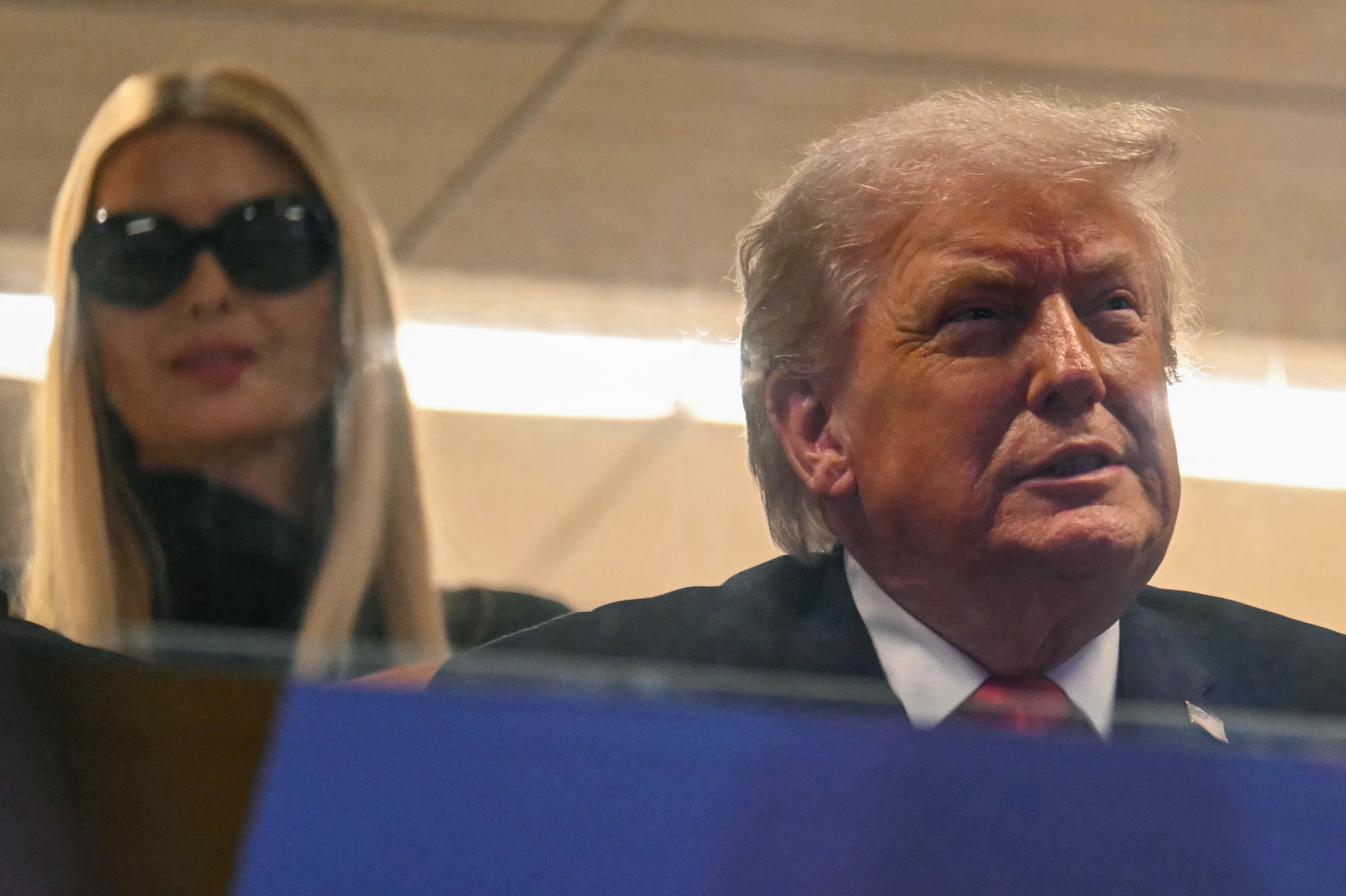 Ivanka looks over her father’s shoulder as the Miami Hurricanes took on the Indiana Hoosiers