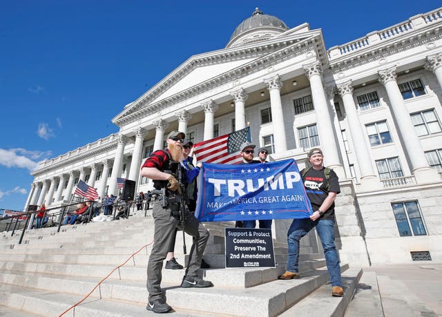 <p>Trump-supporting gun owners pose outside the Utah State Capitol during a Second Amendment rally in Salt Lake City, Utah, February 2020</p>