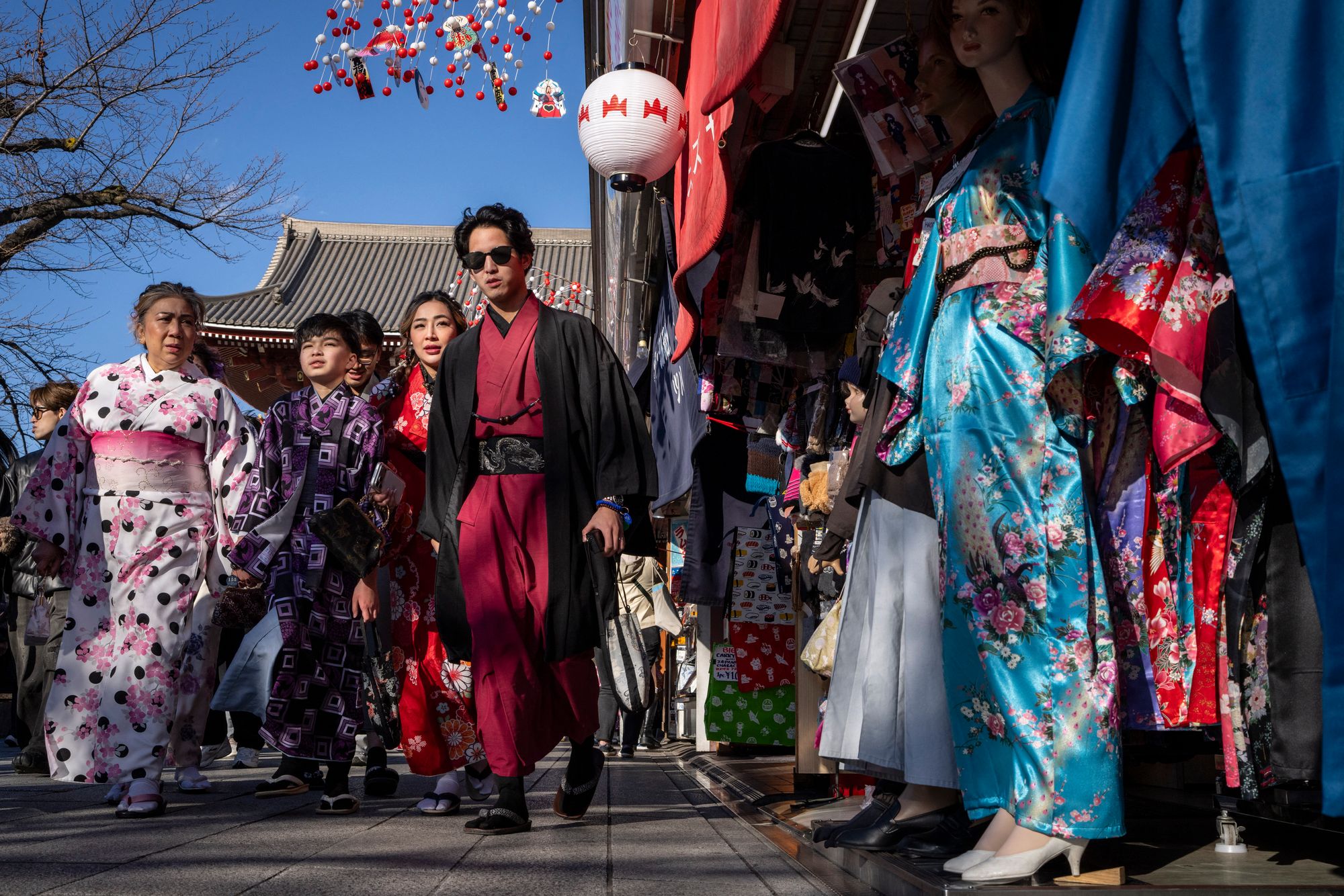 People walk through the Nakamise Shopping Street in Tokyo on 8 January 2026