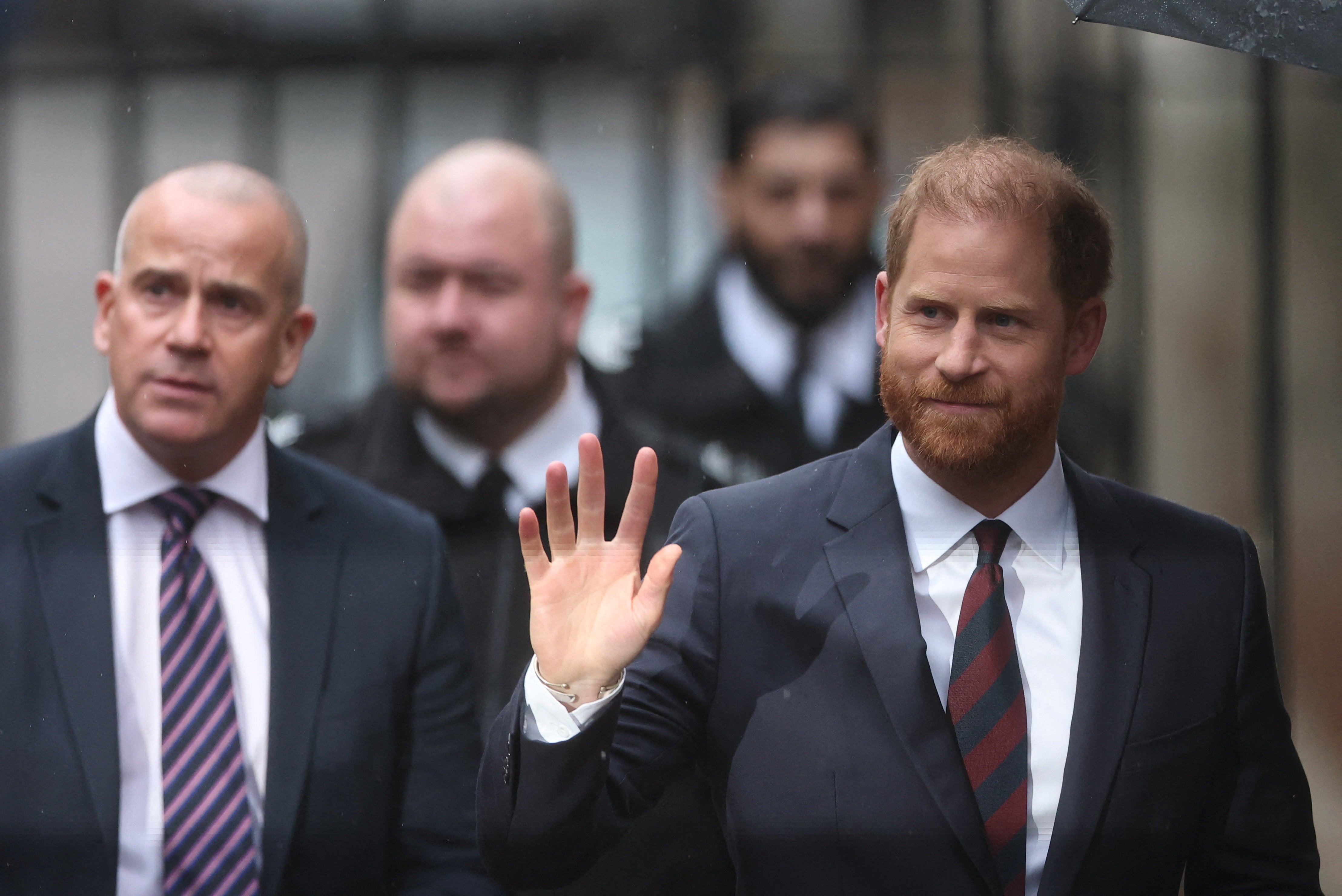 Harry arrives during the first week of a nine-week trial lawsuit against Associated Newspapers