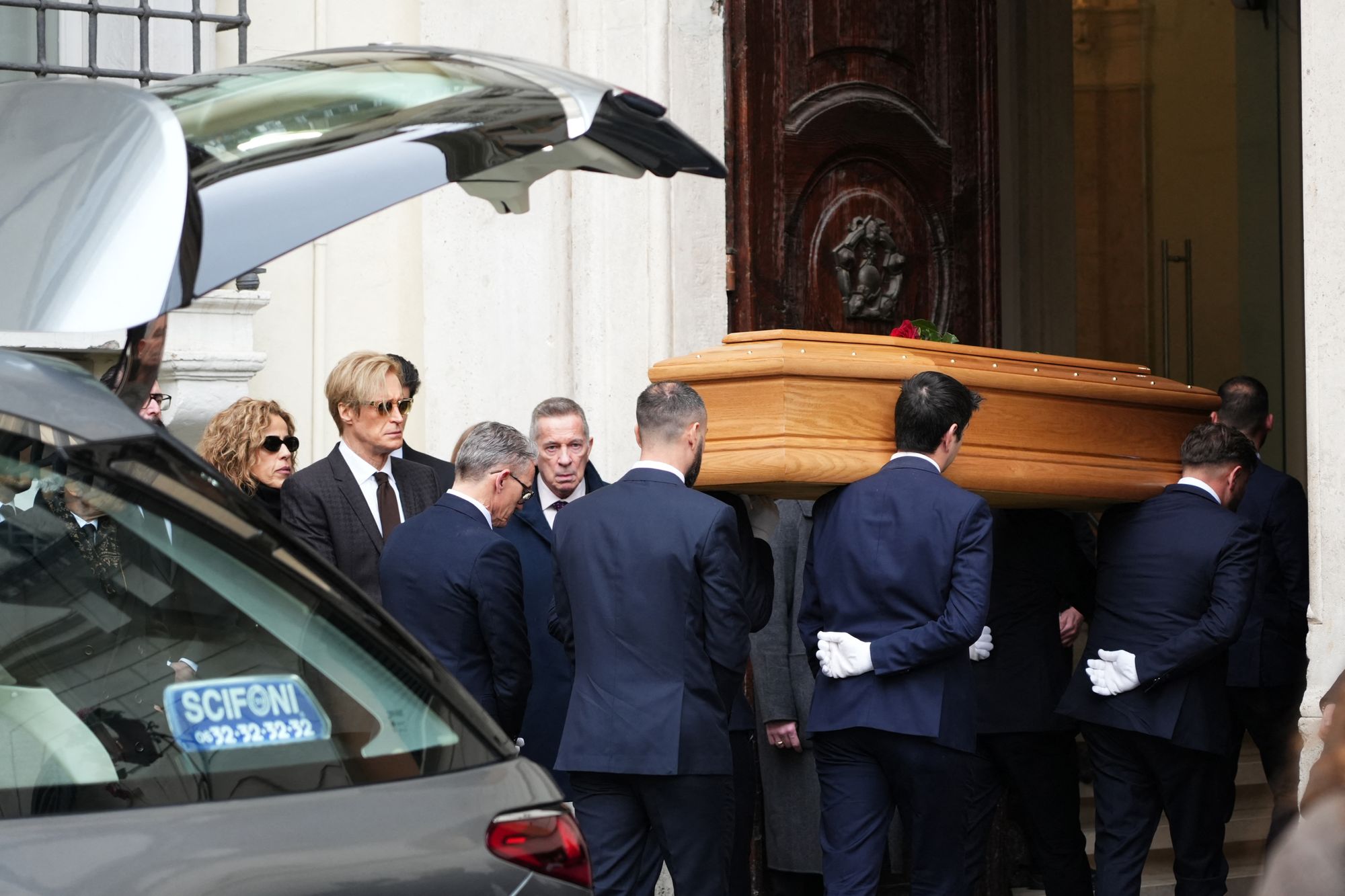 Vernon Bruce Hoeksema (2ndL) stands as pallbearers carry the coffin of late Italian fashion designer Valentino Garavani at the PM23 exhibition site where he will lie in state before the funeral