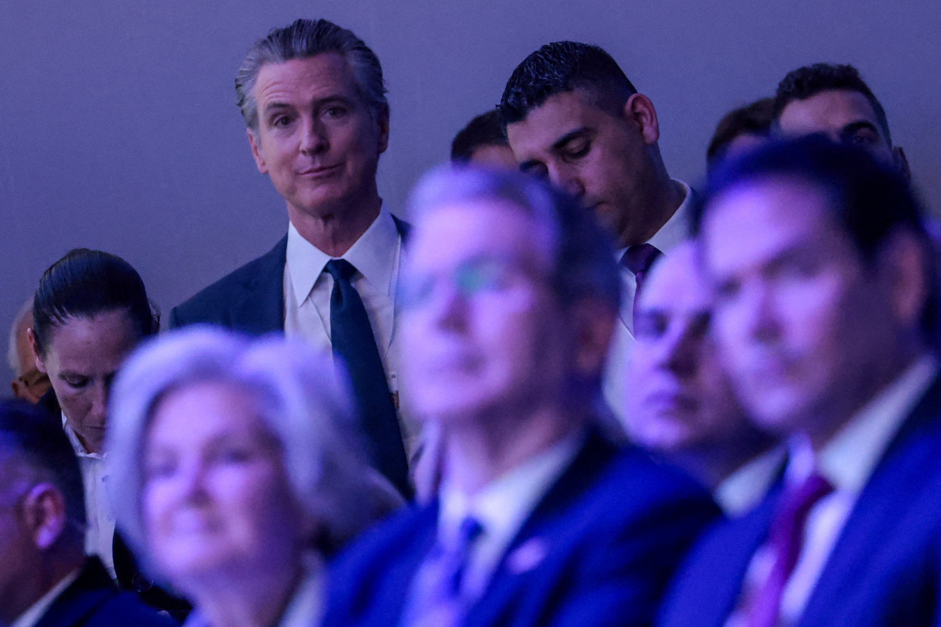 California Gov. Gavin Newsom looks on at members of President Donald Trump’s cabinet watch his speech to the World Economic Forum in Davos, Switzerland, Wednesday