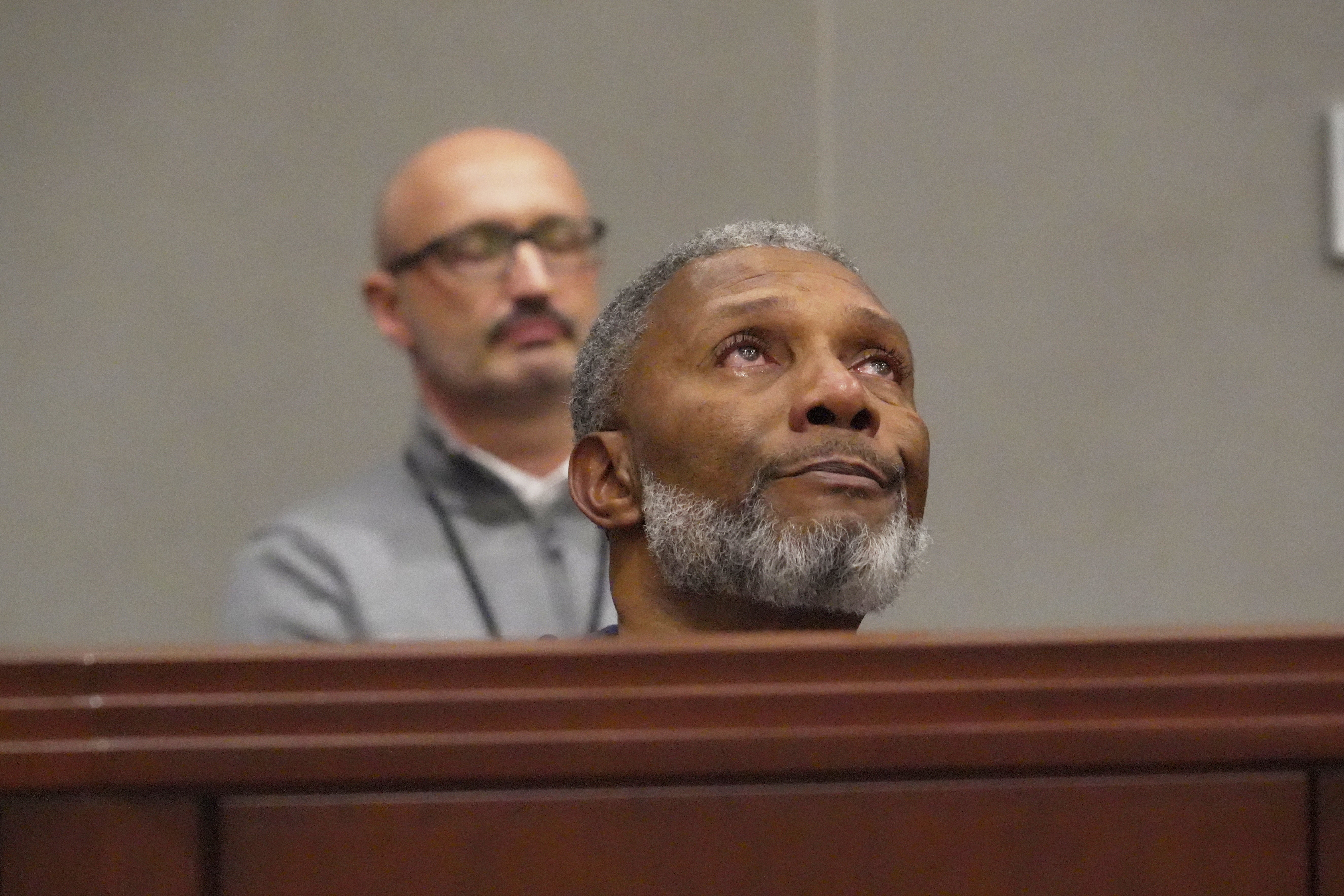 Tears well in Tracey Howard’s eyes as he hears a prosecutor describe his wife Nicole Connors’ murder during a hearing in Wake County Superior Court on Wednesday, Jan. 21, 2026, in Raleigh, N.C. (AP Photo/Allen G. Breed)
