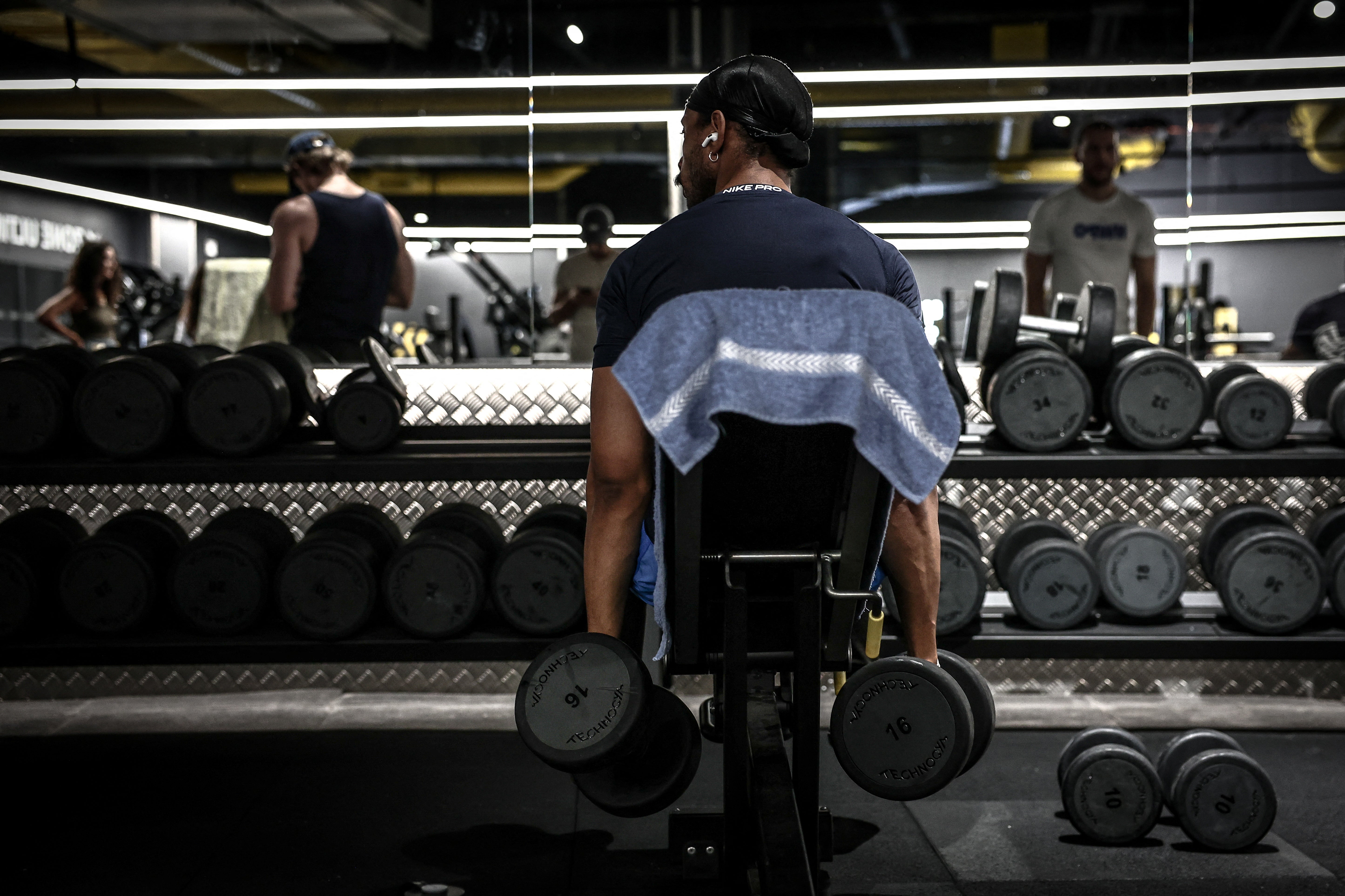 A man lifts weights during a workout