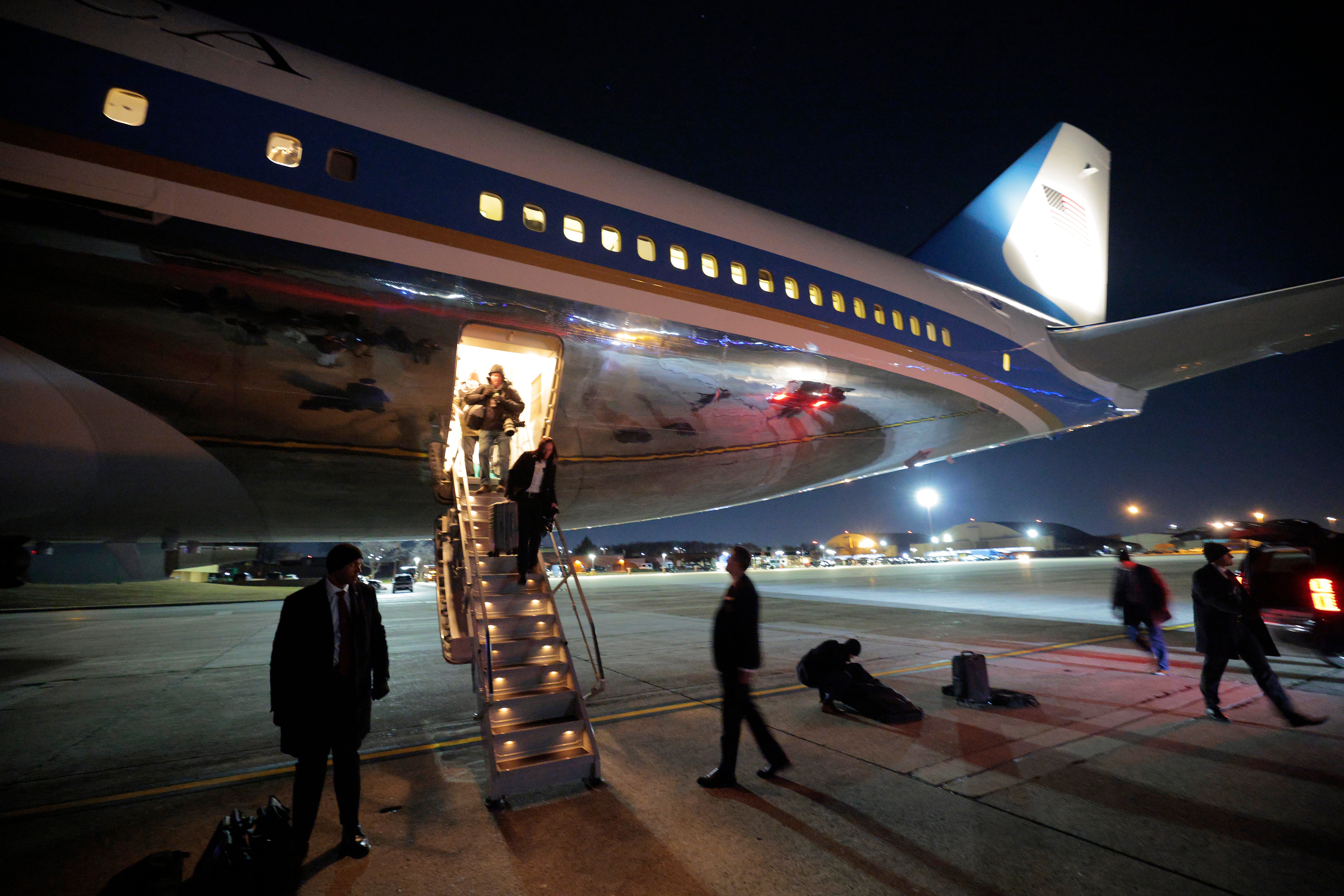 Passengers step down from Air Force One after it returned to Joint Base Andrews in Maryland on Tuesday January 20, 2026