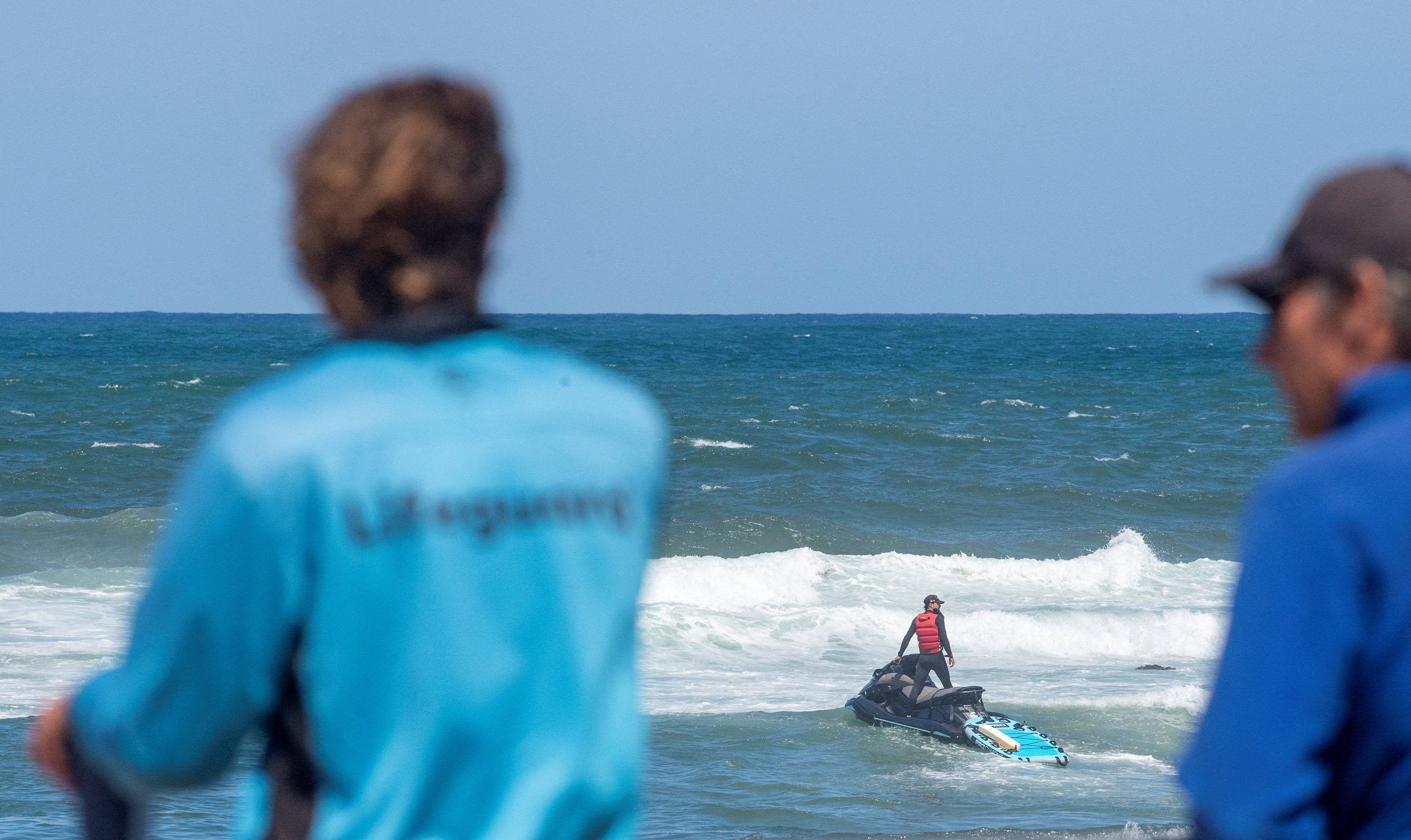 Lifeguards attempt to locate a shark that attacked a surfer at Dee Why Beach in Sydney, Australia, on 19 January 2026