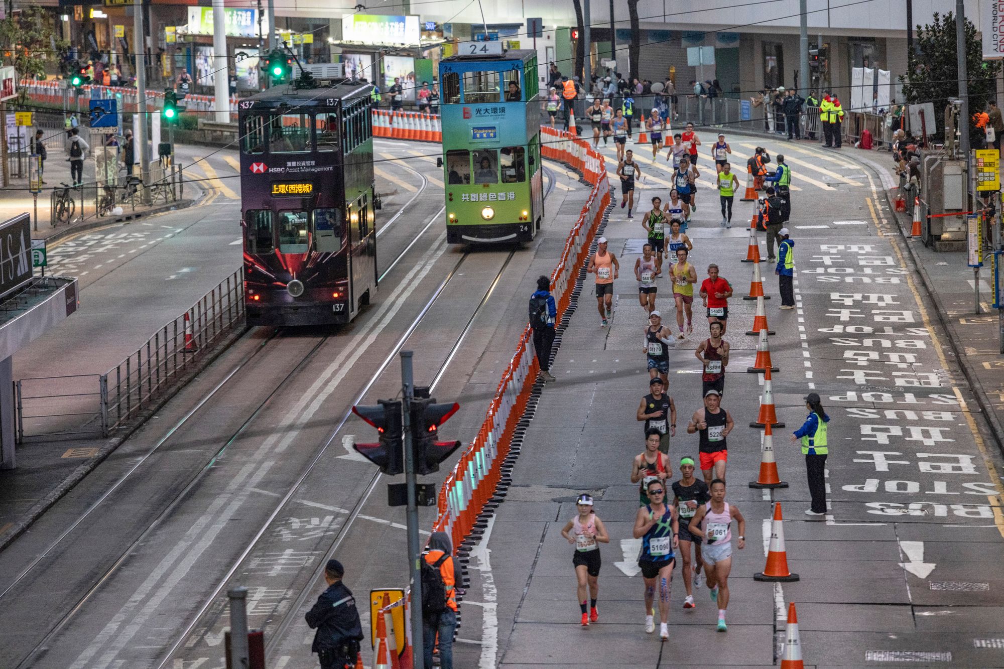 Runners take part in the half marathon race during the Hong Kong Marathon in Hong Kong on January 18, 2026