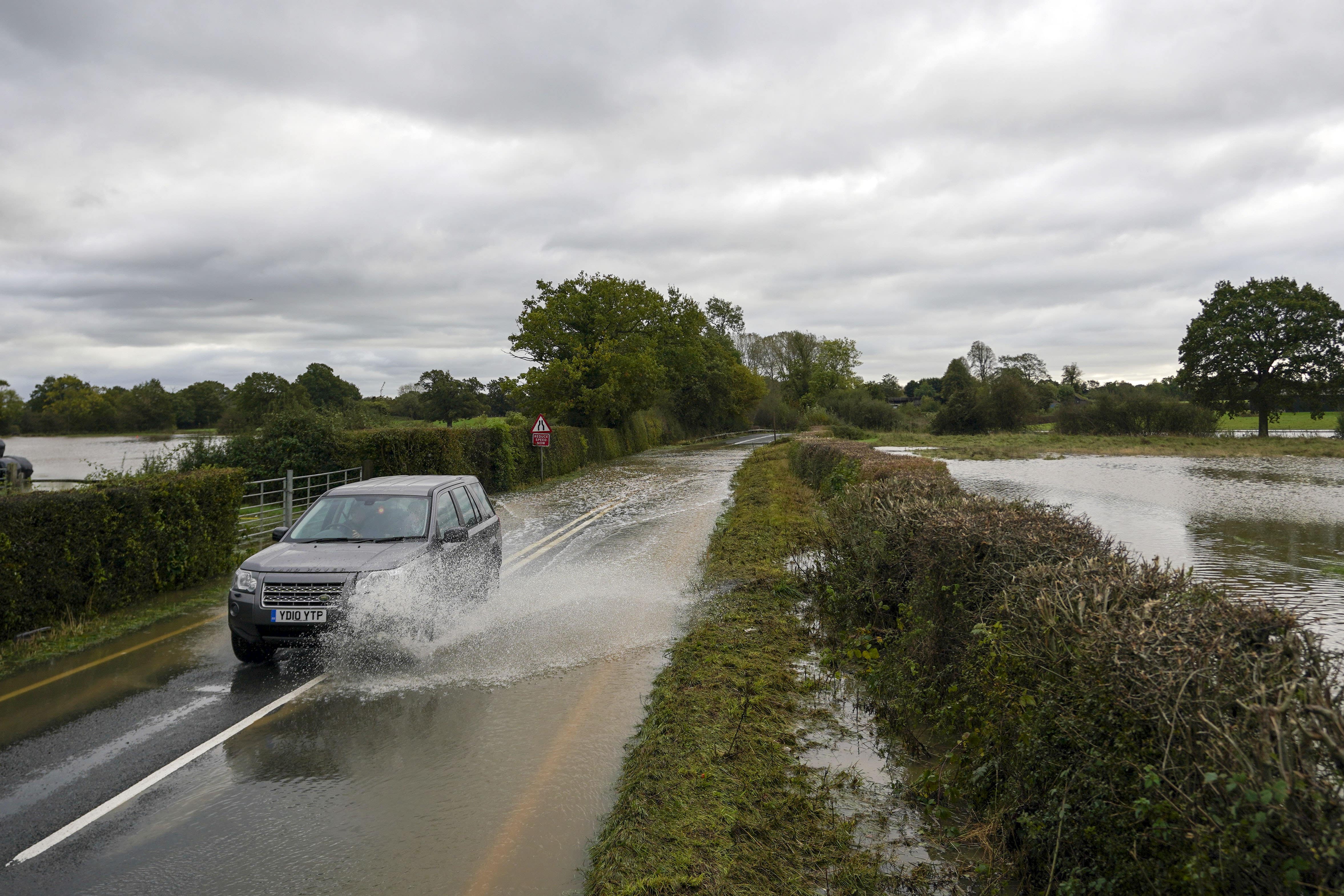 Some roads have been flooded and rail travel is also affected (PA)